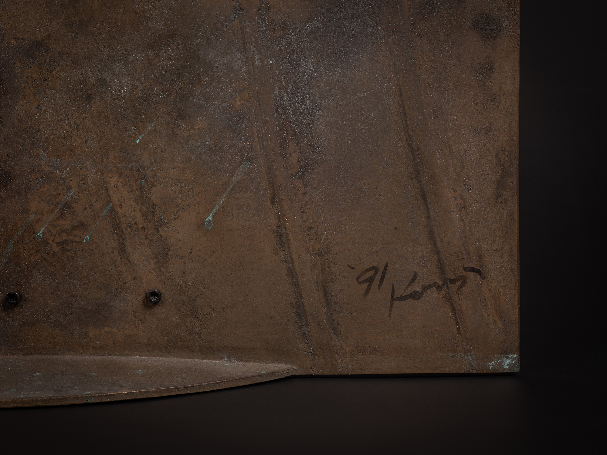 Close up image of artist signature and year work was created (1991).