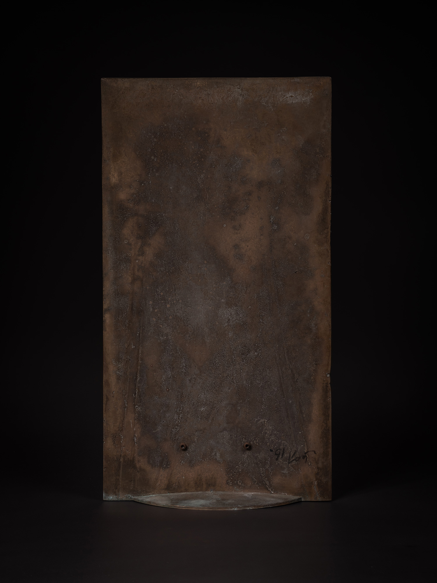 Back view of a bronze artwork by Koji Hatakeyama featuring a tall rectangular bronze panel with...