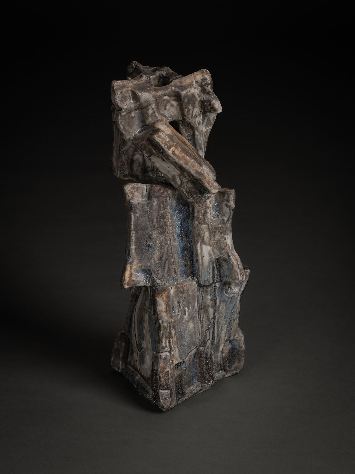 Volcano by Shōzō Michikawa is a vertically stacked ceramic sculpture with sharply angled planes,...