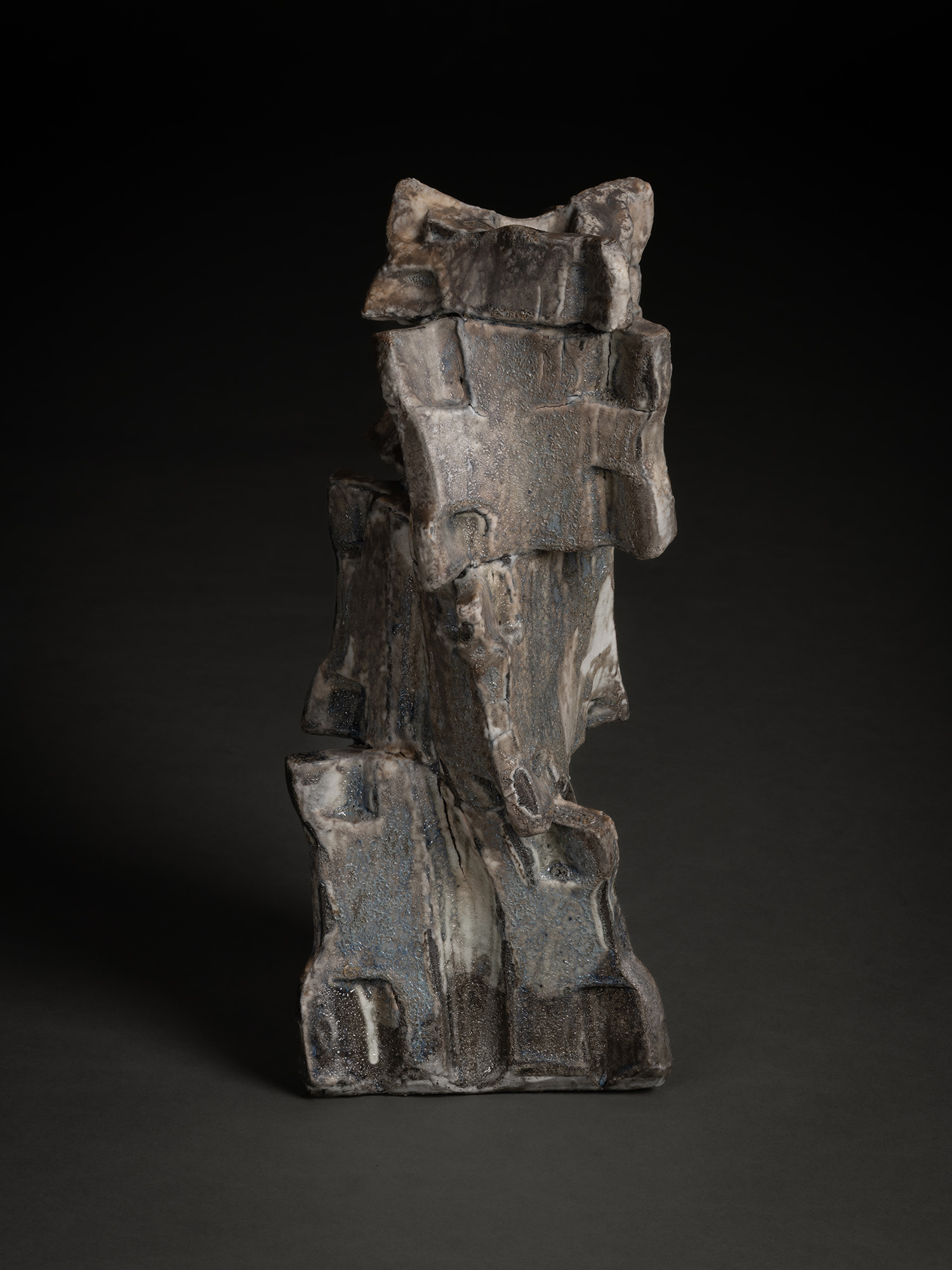 Volcano by Shōzō Michikawa is a vertically stacked ceramic sculpture with sharply angled planes,...