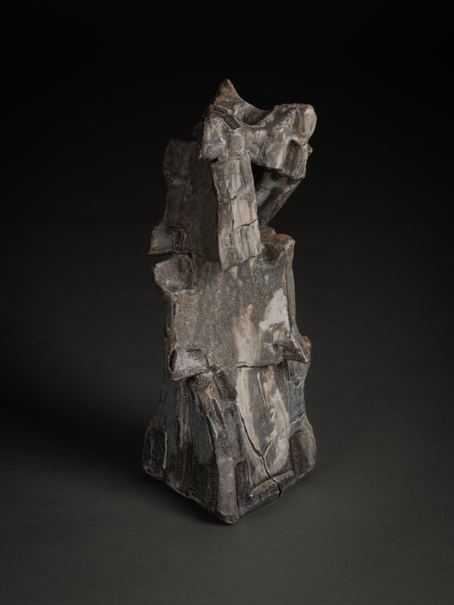 Volcano by Shōzō Michikawa is a vertically stacked ceramic sculpture with sharply angled planes,...