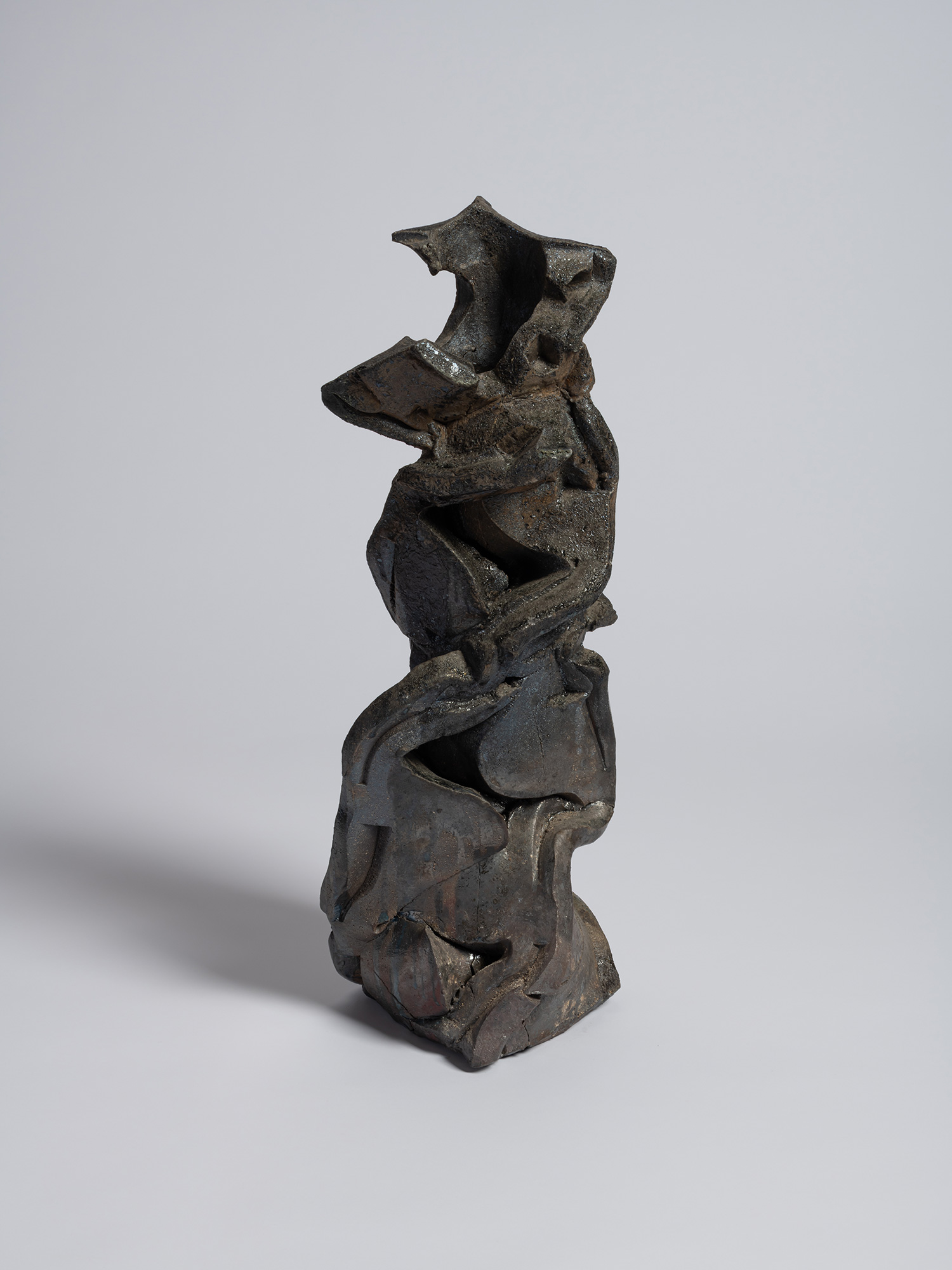 A vertically oriented, highly architectural contemporary ceramic sculpture titled Volcano by Shozo...
