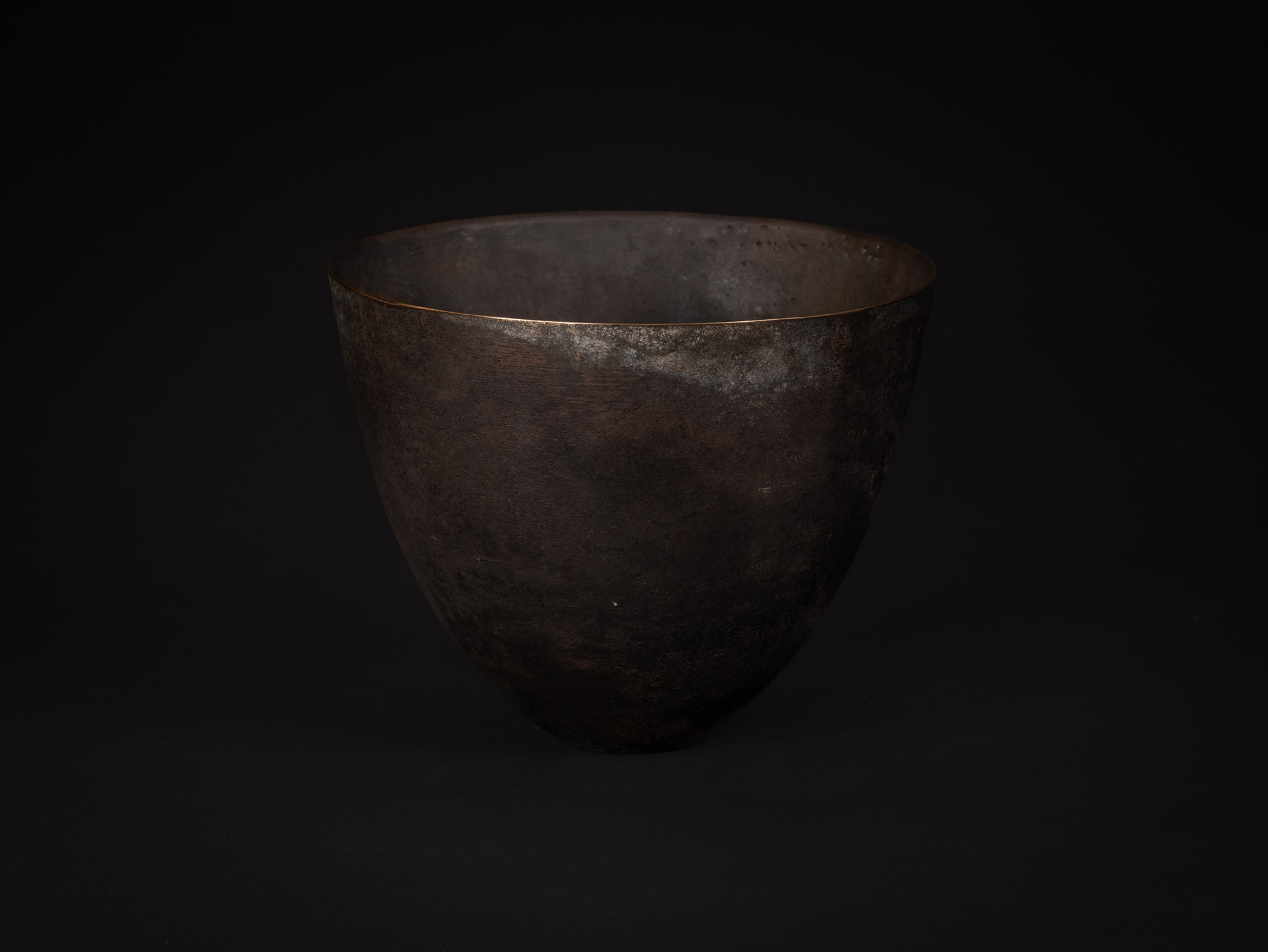 bronze as Bronze No. 7 by Koji Hatakeyama showing a rounded bronze vessel with a wide opening,...