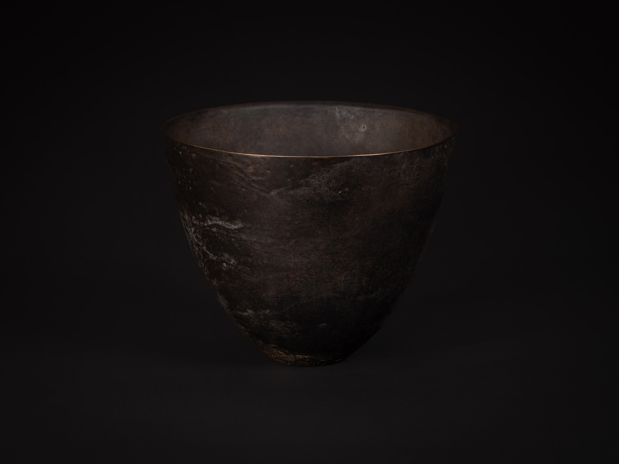 Bronze No. 7 by Koji Hatakeyama, viewed from the front, showing a rounded bronze vessel with a...