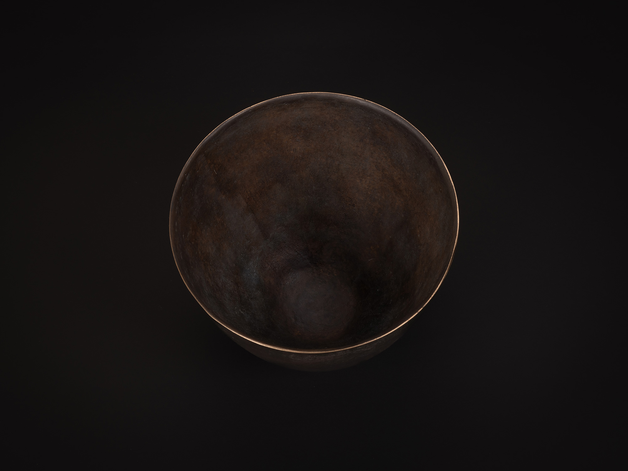 Aerial view of bronze as Bronze No. 7 by Koji Hatakeyama, showing the circular opening and smooth...