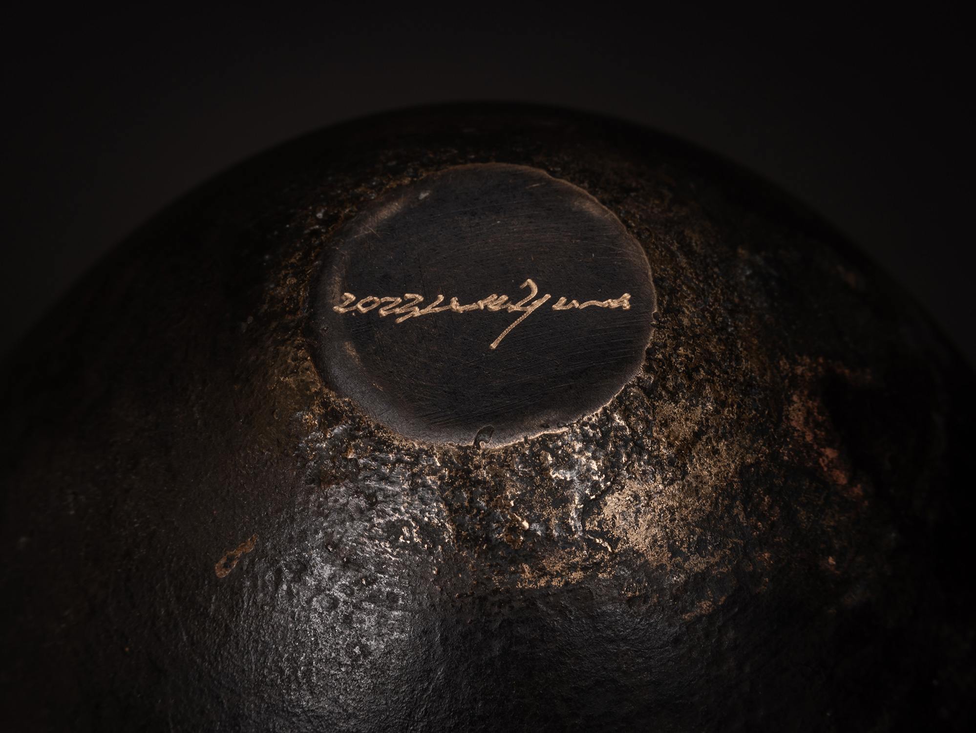 Underside of bronze as Bronze No. 7 by Koji Hatakeyama showing the textured bronze base with the...