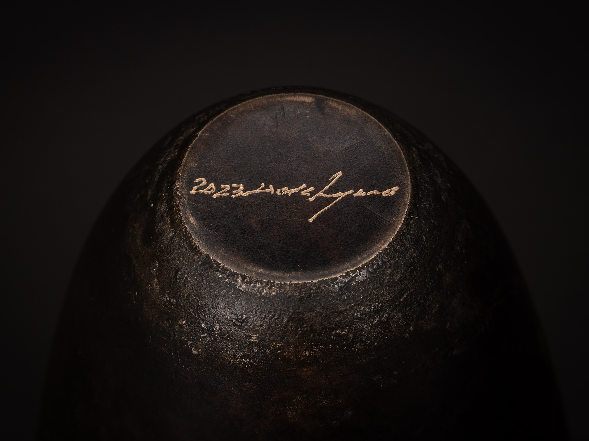 Close-up of the underside of bronze as Bronze No. 9 showing Koji Hatakeyama’s incised signature...