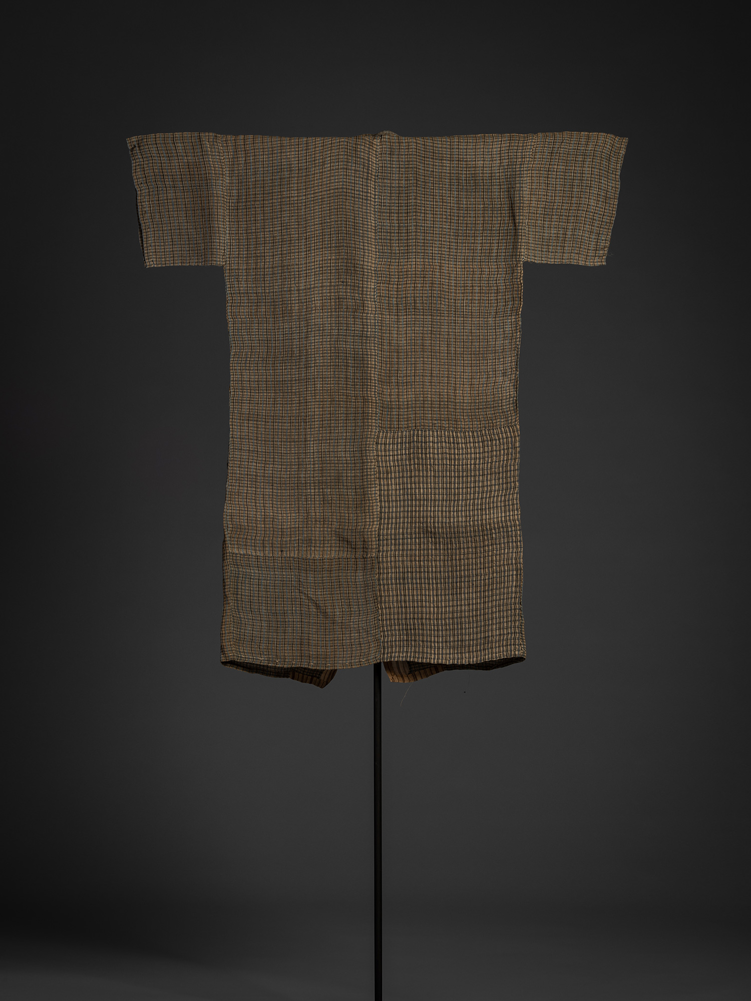 Full back view of the bashōfu kimono. The lightweight textile is woven with a regular plaid pattern...