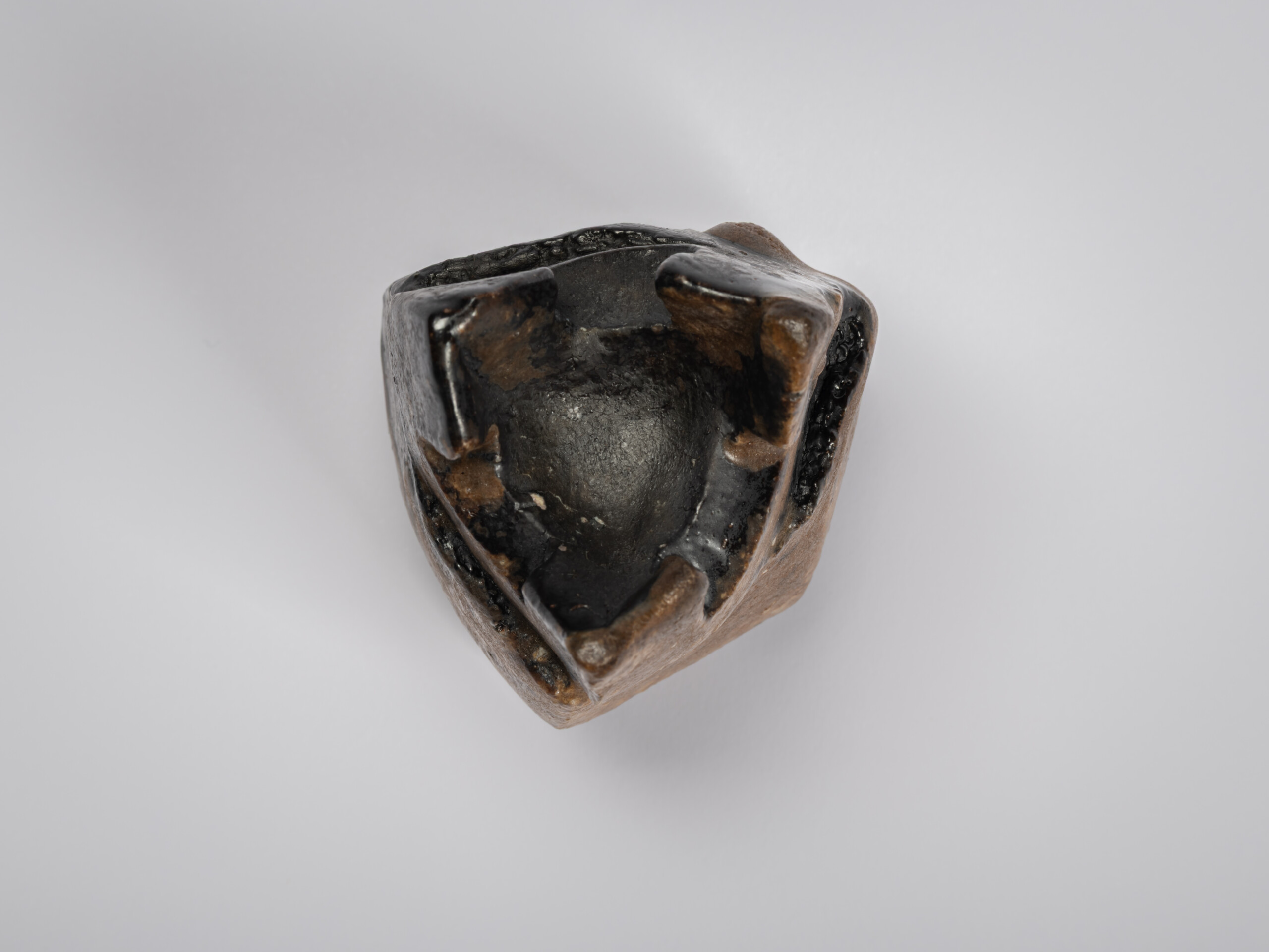 Bottom view of Black Guinomi by Ryuichi Kakurezaki showing the triangular foot arrangement and...