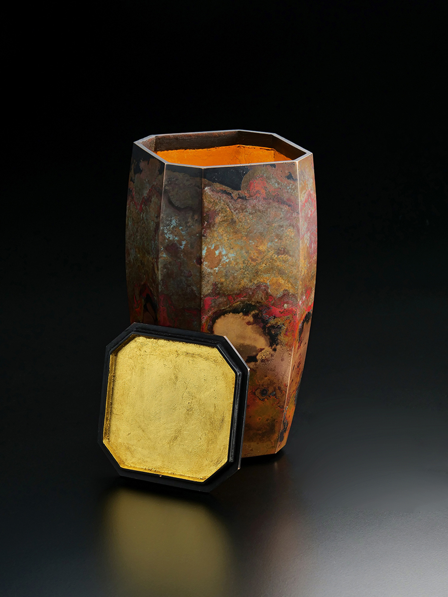 Three-quarter view of Eight Faces by Koji Hatakeyama, an octagonal copper vessel with gently tapered...