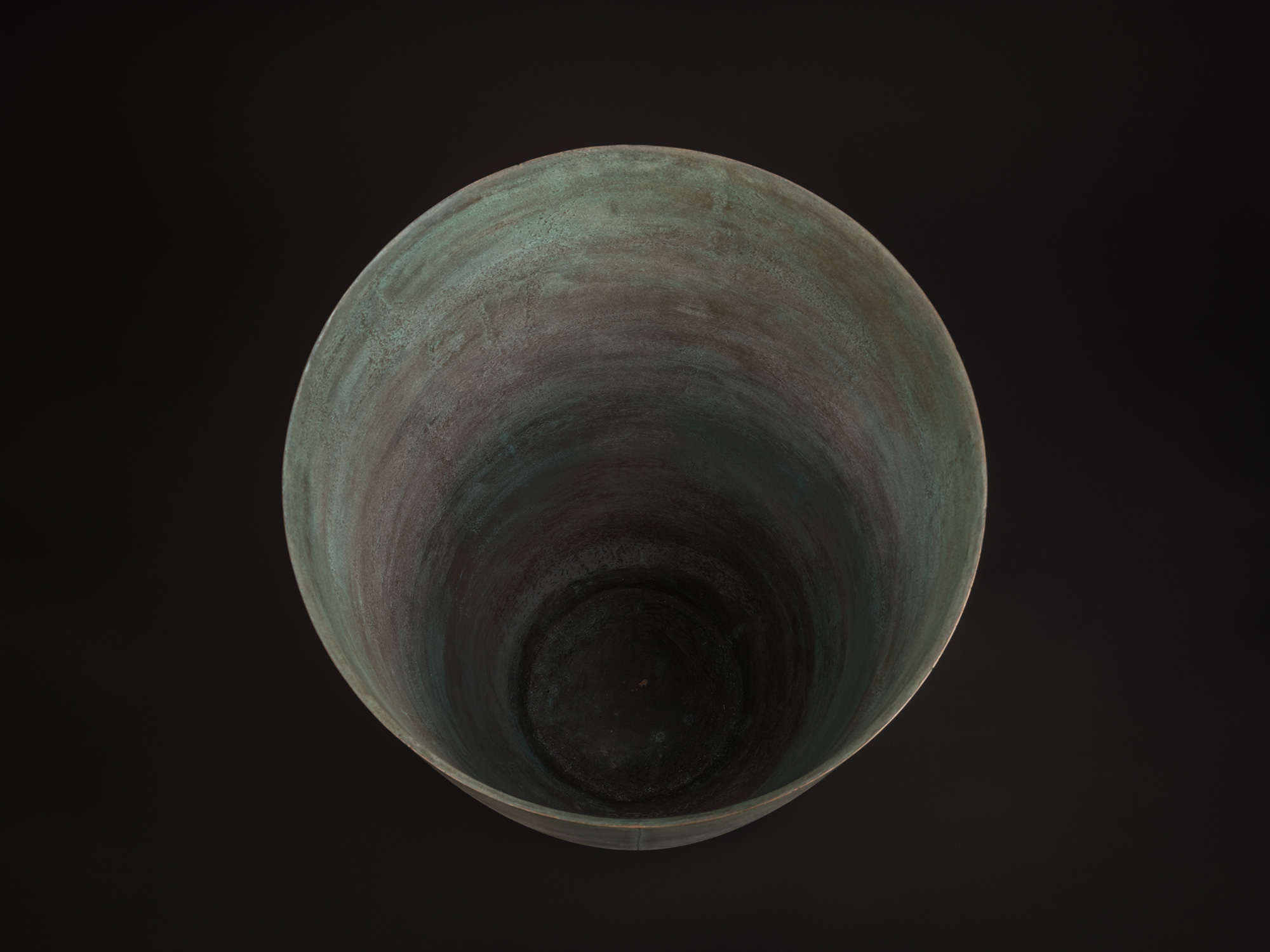 Overhead view of Existing in Bronze by Hatakeyama, showing the vessel’s broad circular opening...