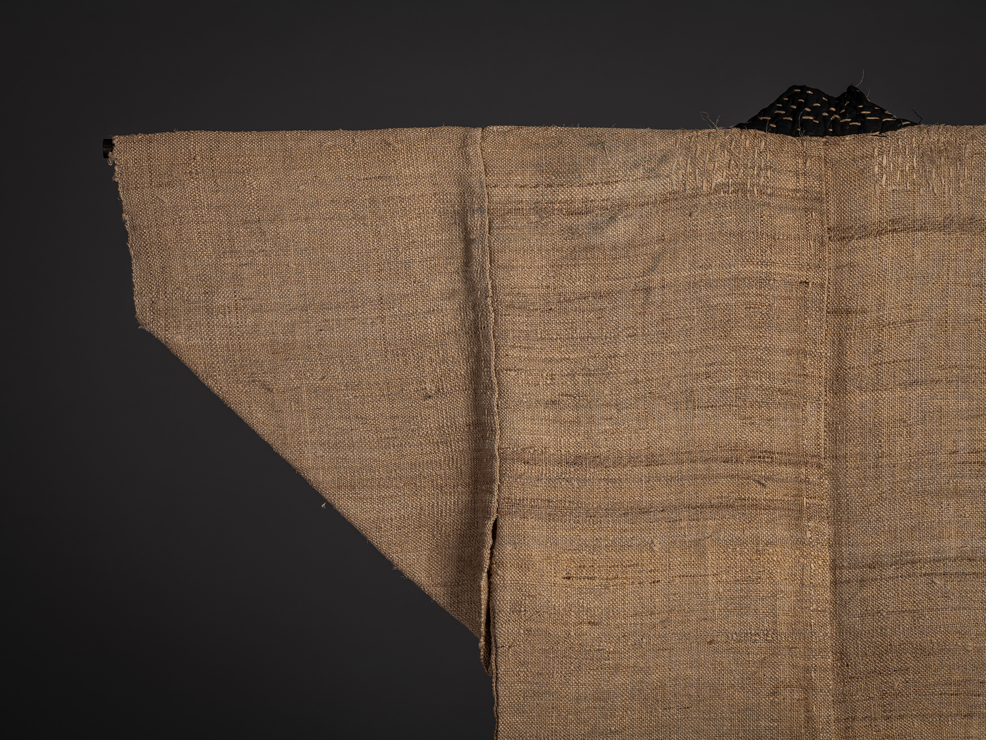 Close-up of the upper back and left sleeve of the fujifu robe, showing the open weave and subtle...