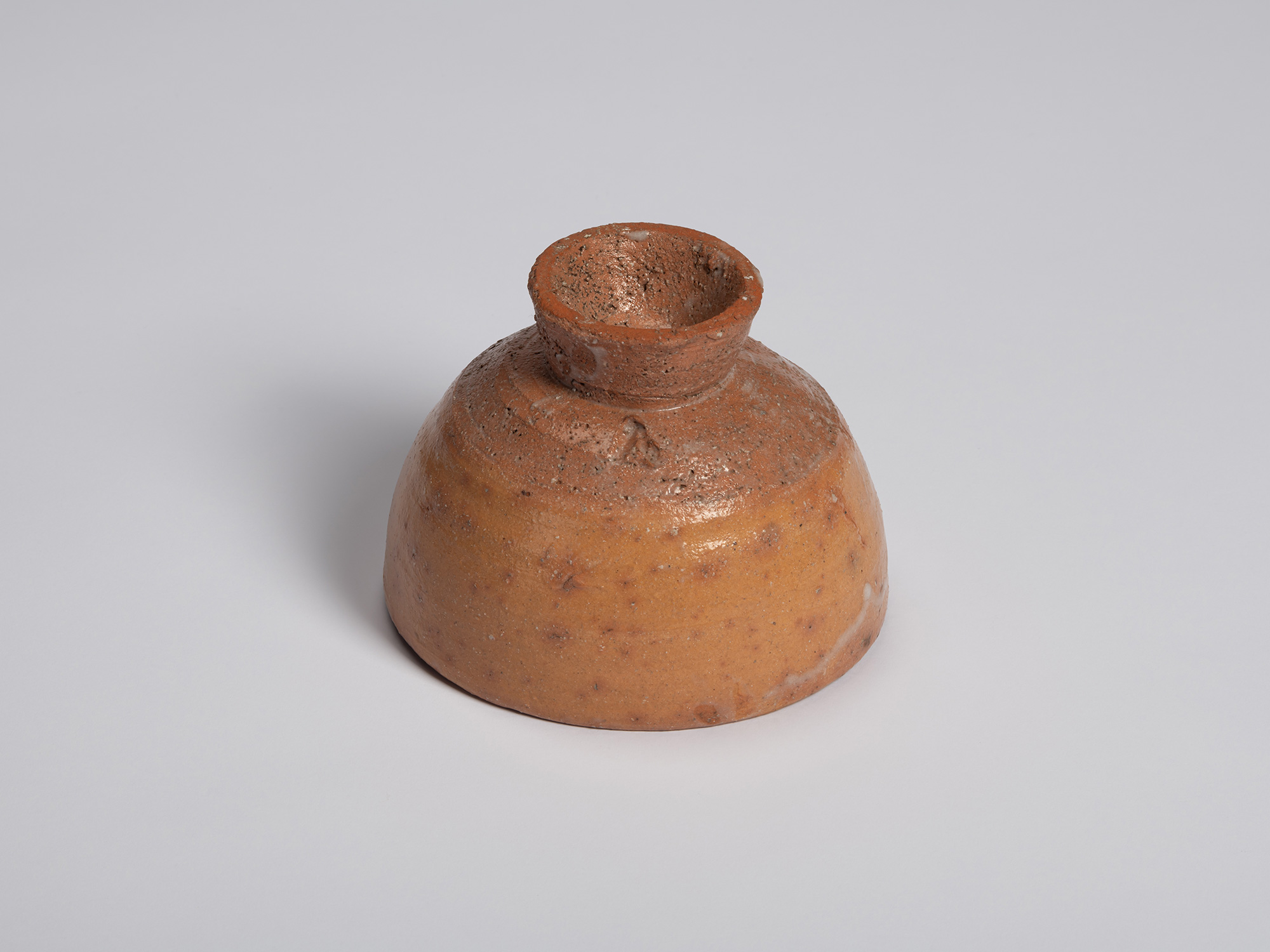 Underside view of Goki Chawan showing the elevated foot ring and exposed clay base. The foot is...