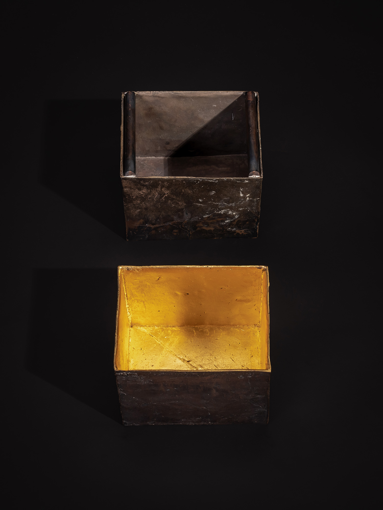 Overhead view of the two separated components of Inner Existence. The lower box reveals a gold-leaf-lined...