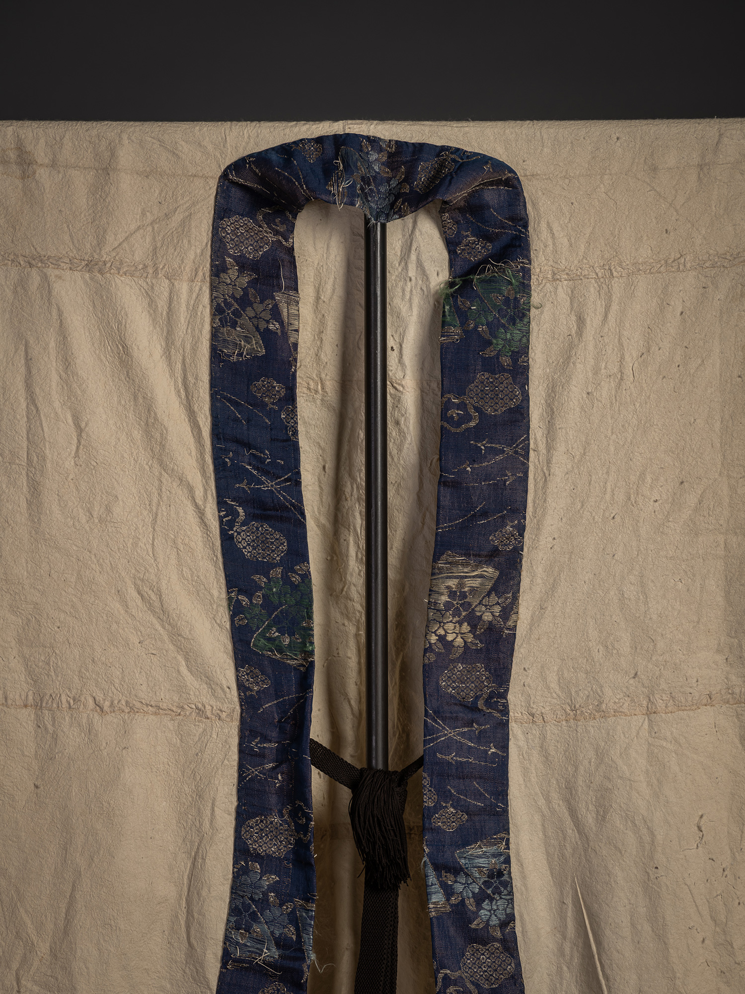 Close-up of the upper front of the kamiko surcoat highlighting the blue silk collar. The collar...