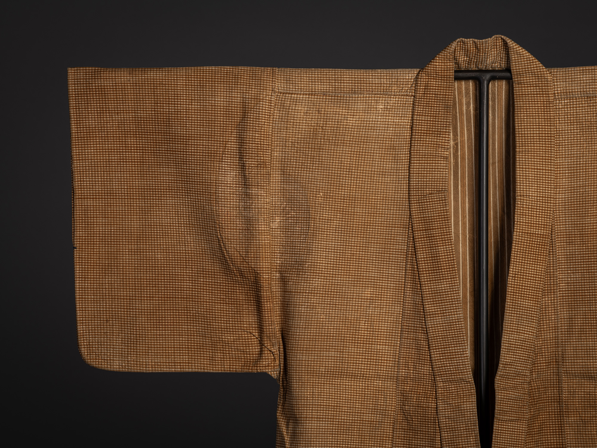 Close-up of the front right shoulder and sleeve of the kawabaori, highlighting the finely woven...