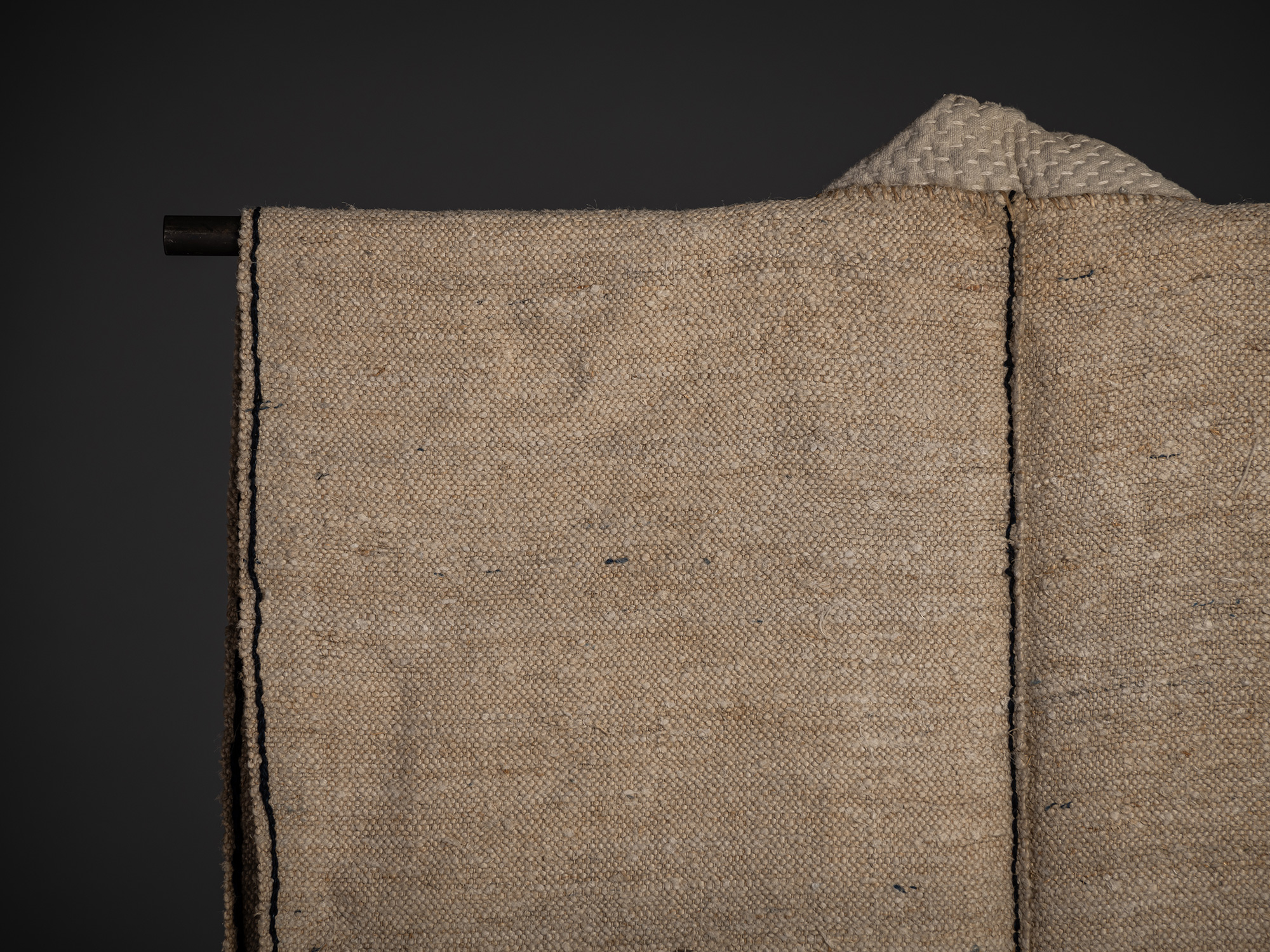 Close-up of the upper left shoulder area on the back of an okusozakkuri sleeveless work garment...