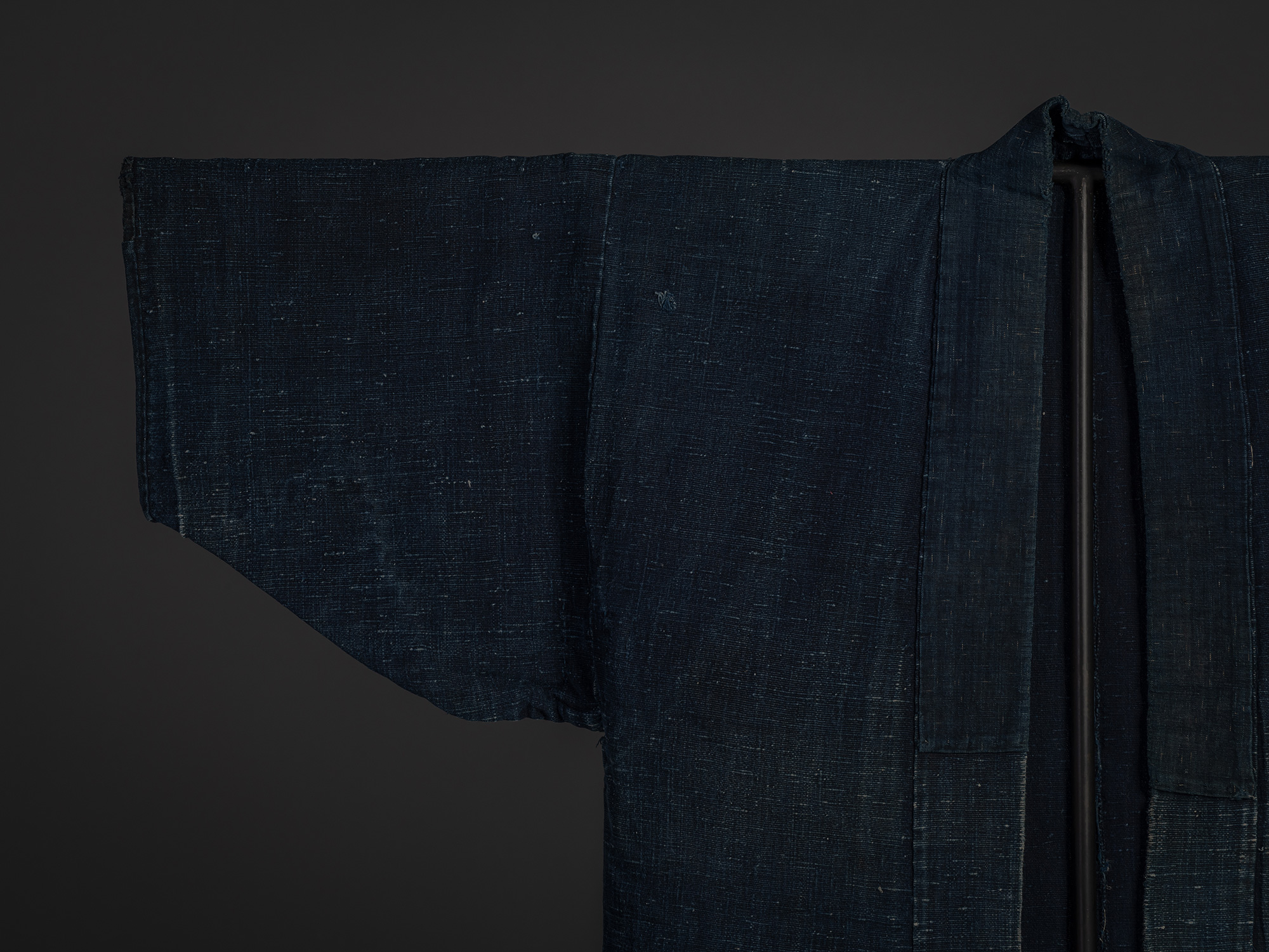 Close-up of the upper front of the Shifu kimono, focusing on the right sleeve, shoulder, and collar....