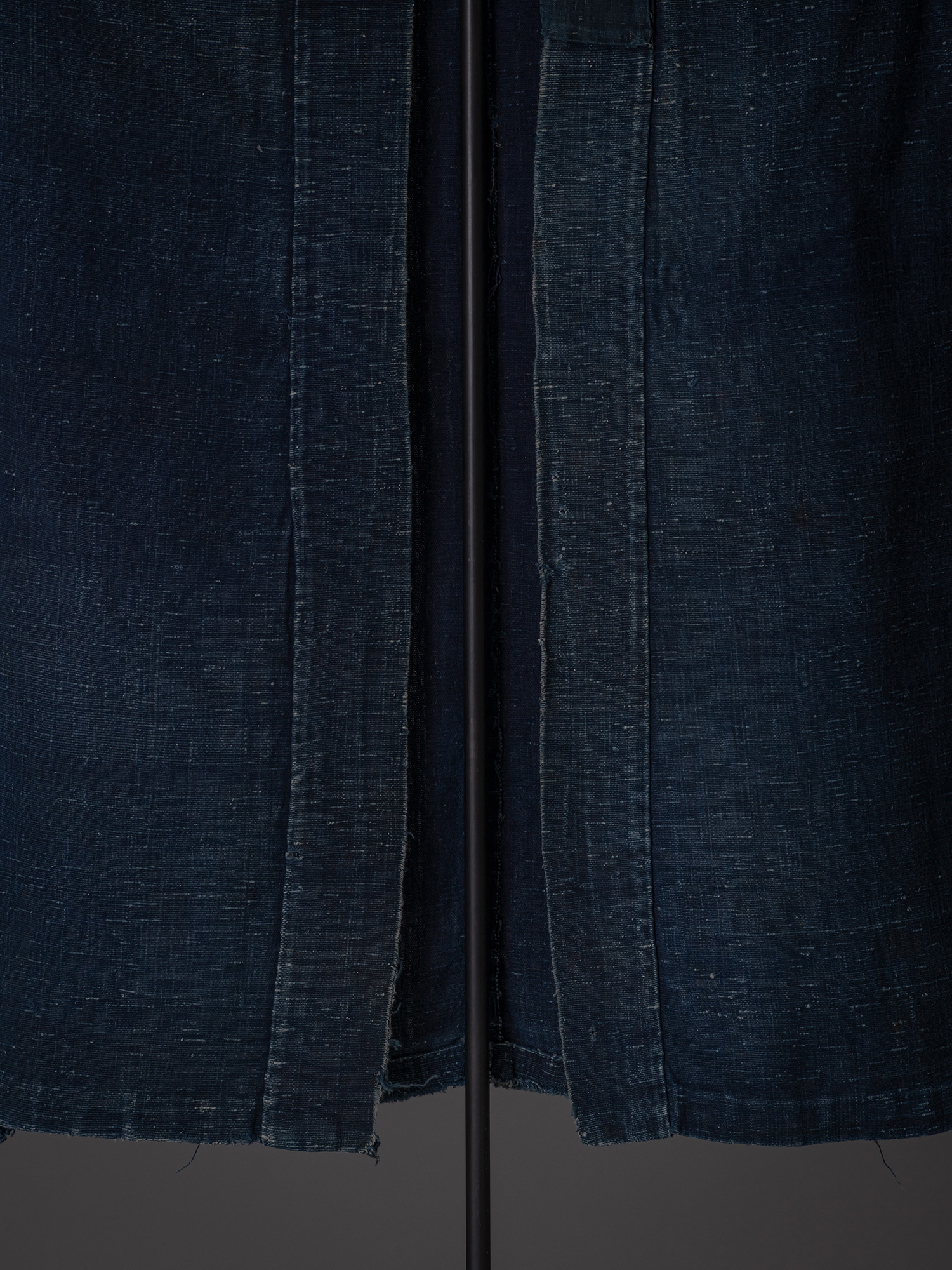 Close-up of the front opening and lapels of the Shifu kimono. The wide collar bands frame the open...