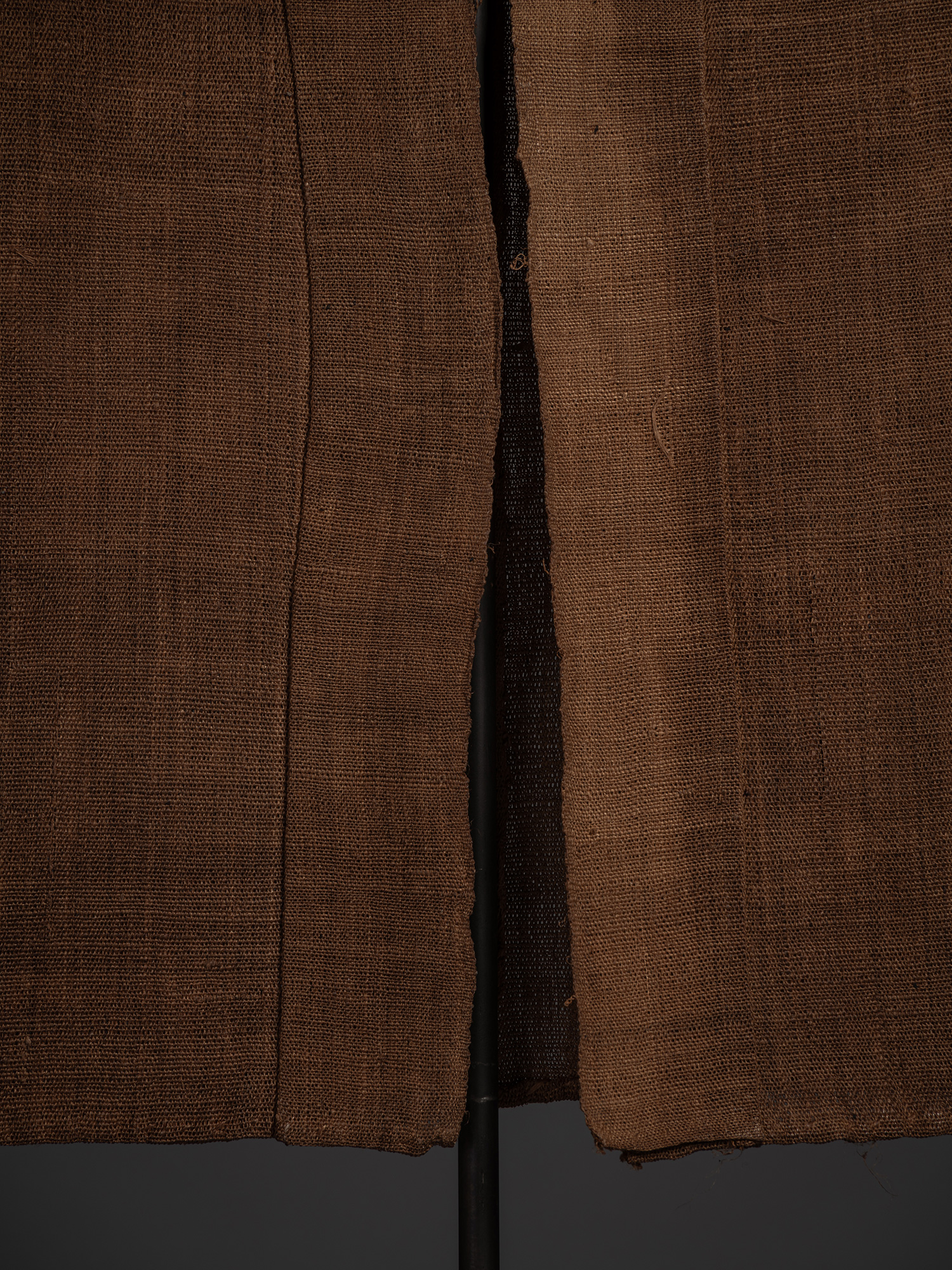 Detail of the lower front opening of the shinafu hanten, showing the overlapping front panels and...