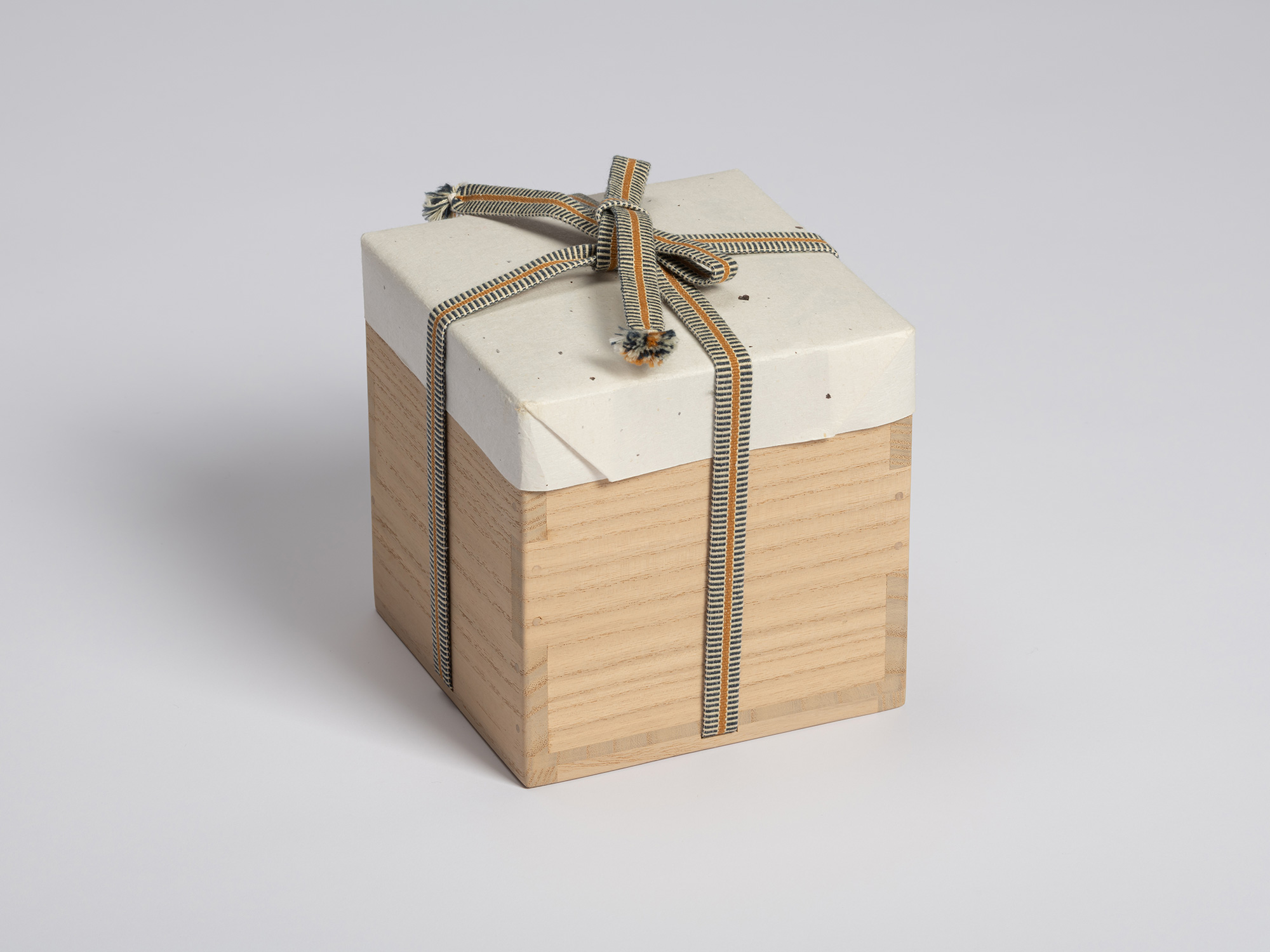 Tomobako for a Shino Chawan by Shiro Tsujimura. The paulownia wood storage box is wrapped in protective...