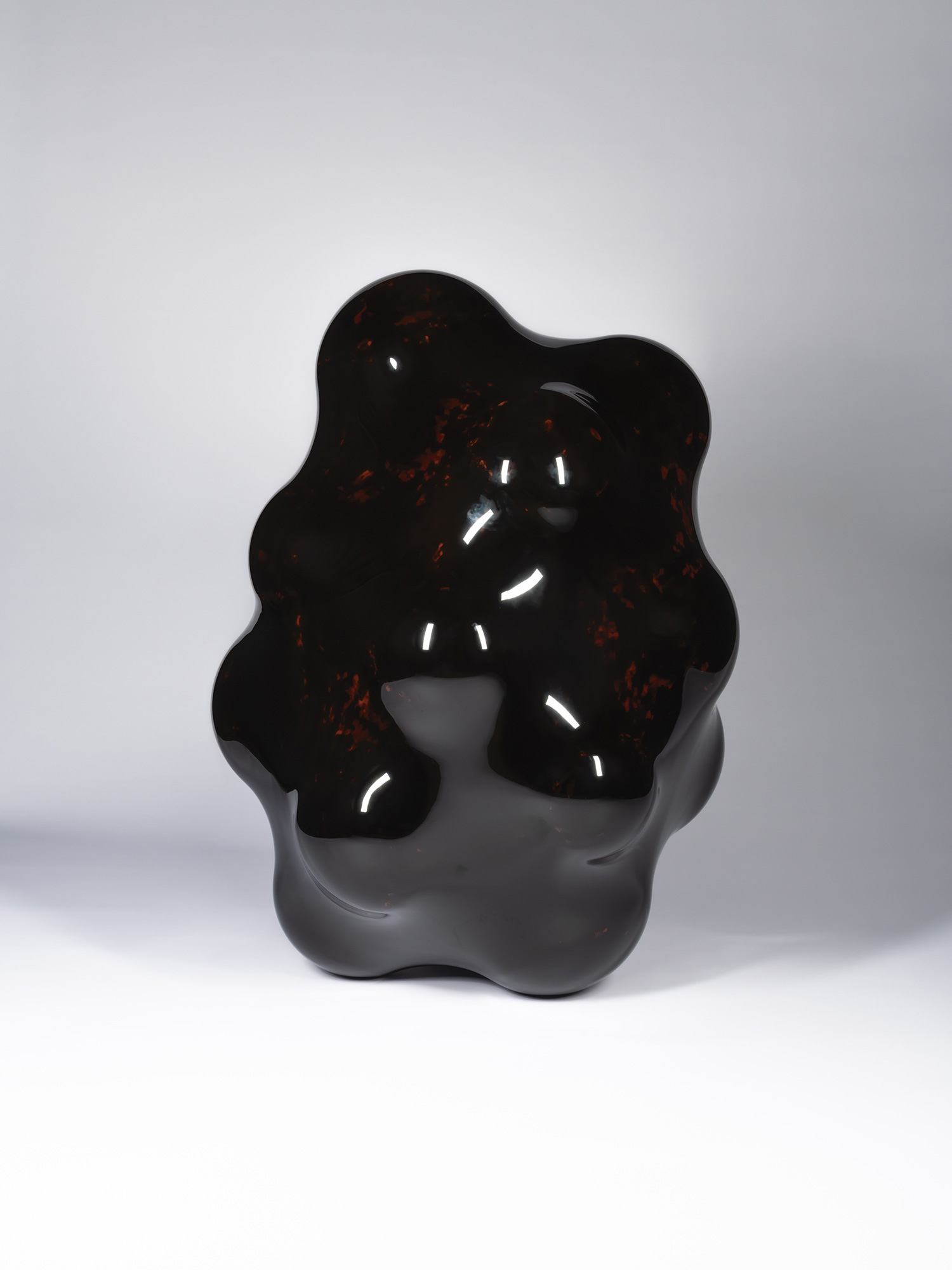 Surface Tactility #22 by Ishizuka. Organic sculptural form with a highly polished deep garnet surface....