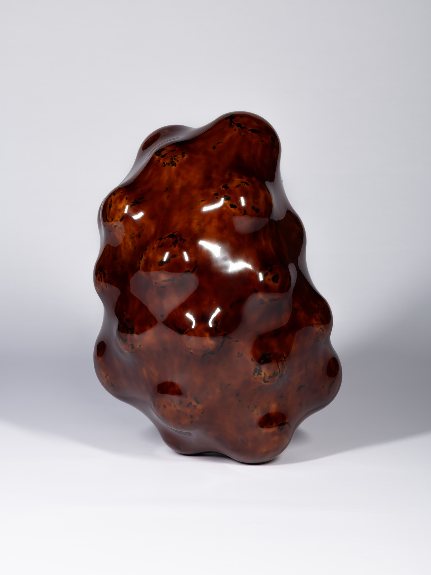 View of Surface Tactility #5 showing an uneven vertical form with rounded lobes and recessed cavities....
