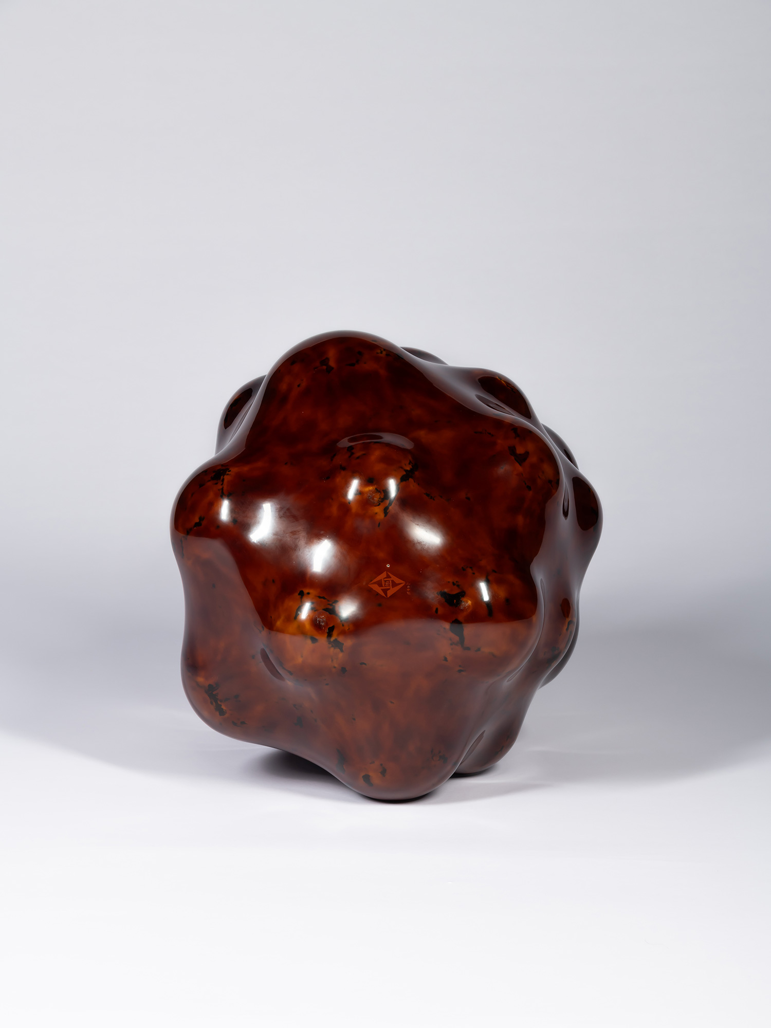 Bottom view of Surface Tactility #5 by Ishizuka. The sculpture rests on several rounded points...