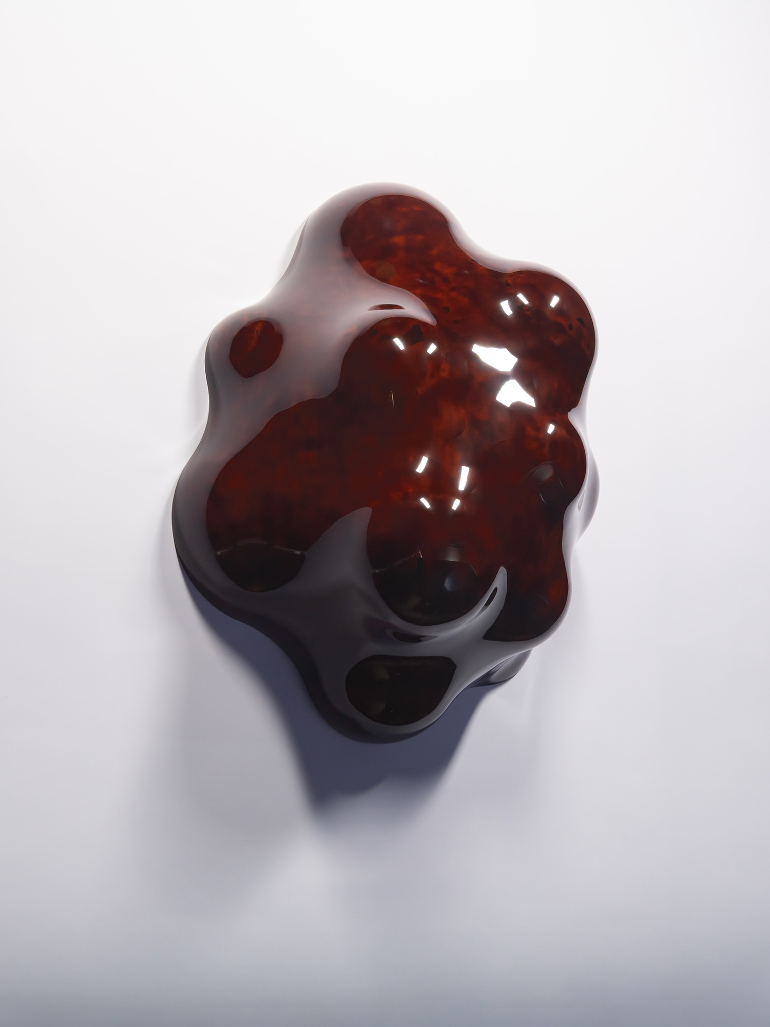 Installation view of Surface Tactility (on wall) #1 mounted on a white wall. The irregular sculptural...