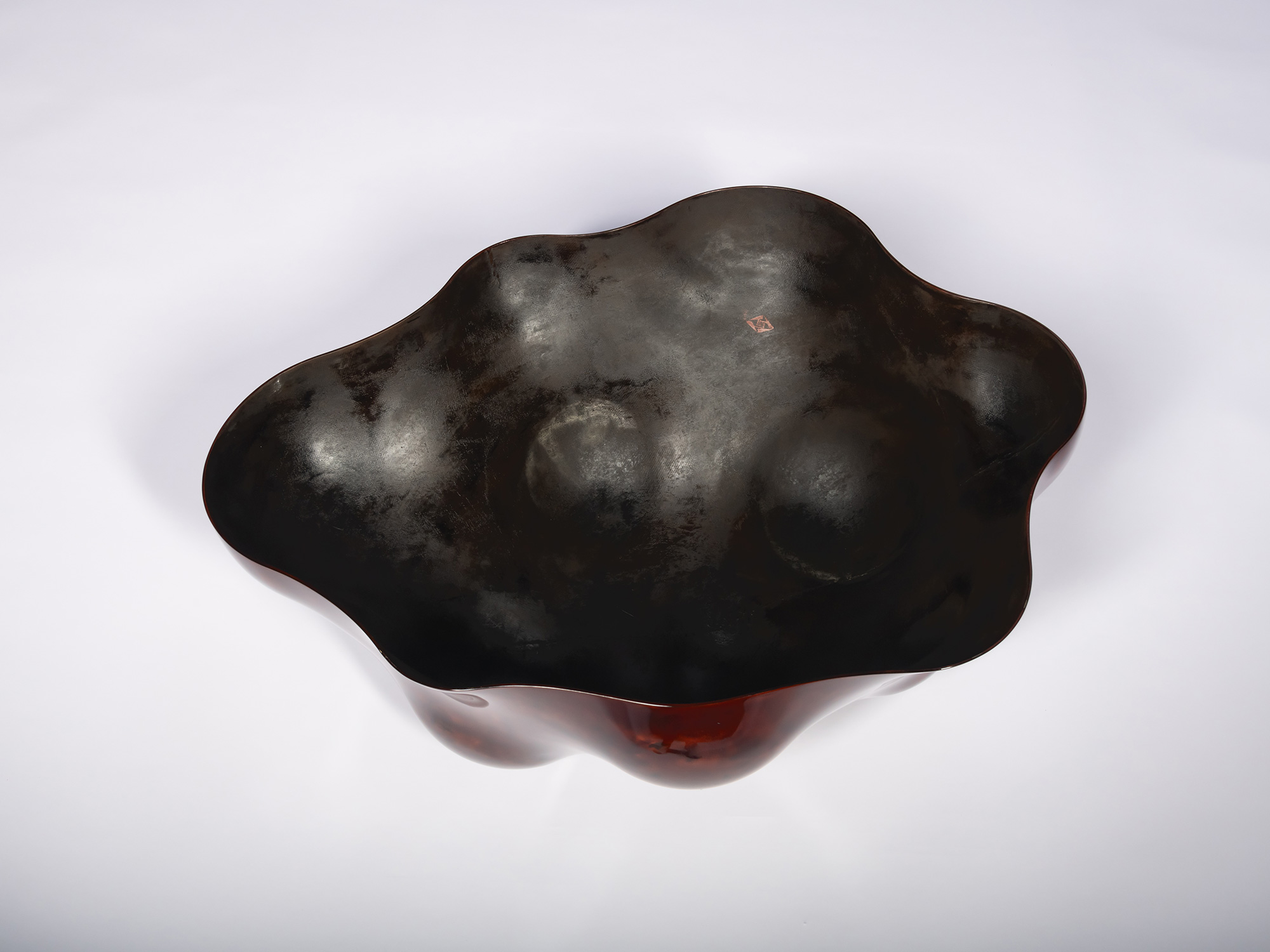 Hollow reverse of Surface Tactility (on wall) #1. The interior surface is finished in a dark, matte-to-satin...