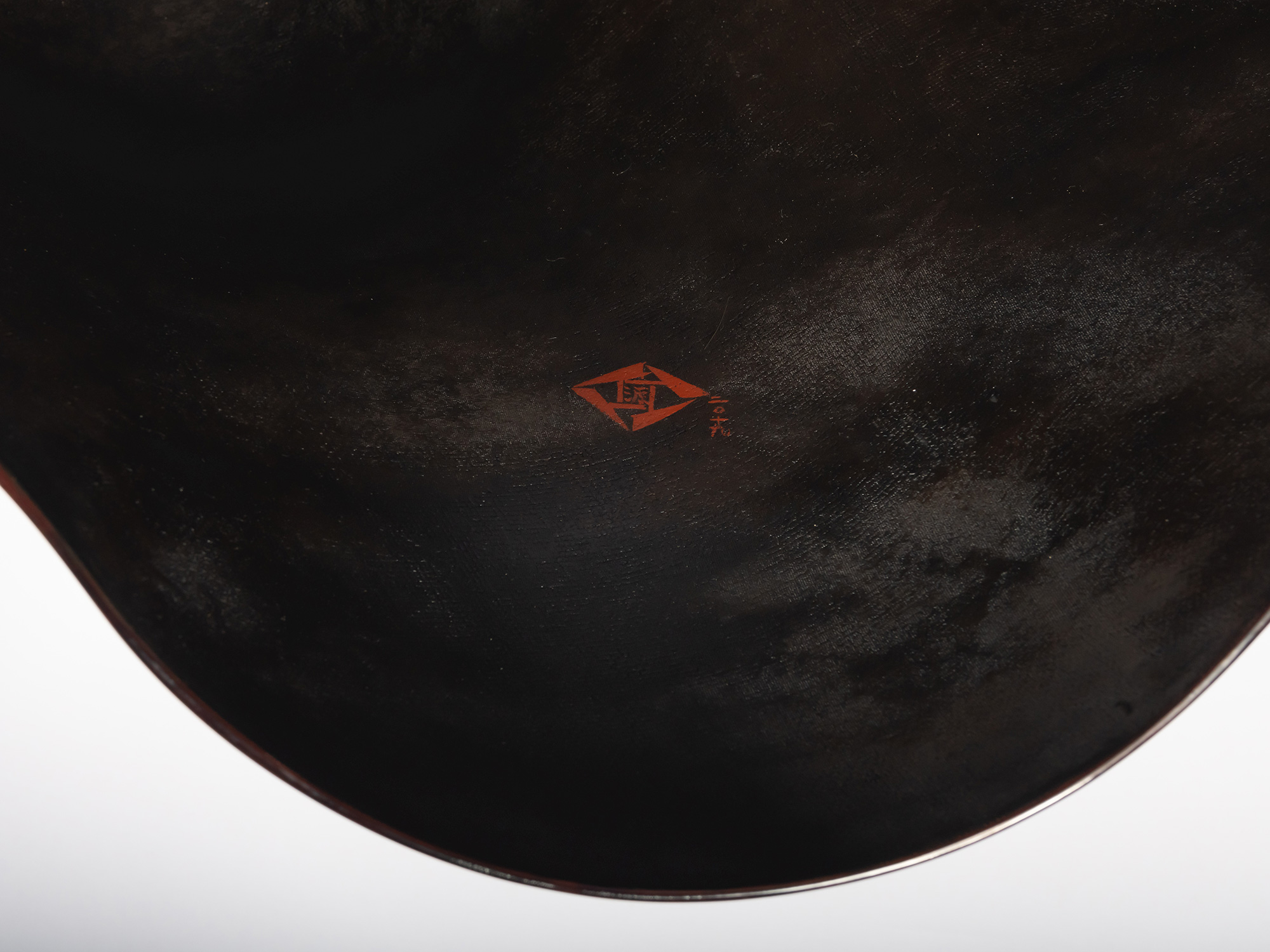 Close-up of the interior surface showing the artist’s red seal and inscription. The seal is positioned...