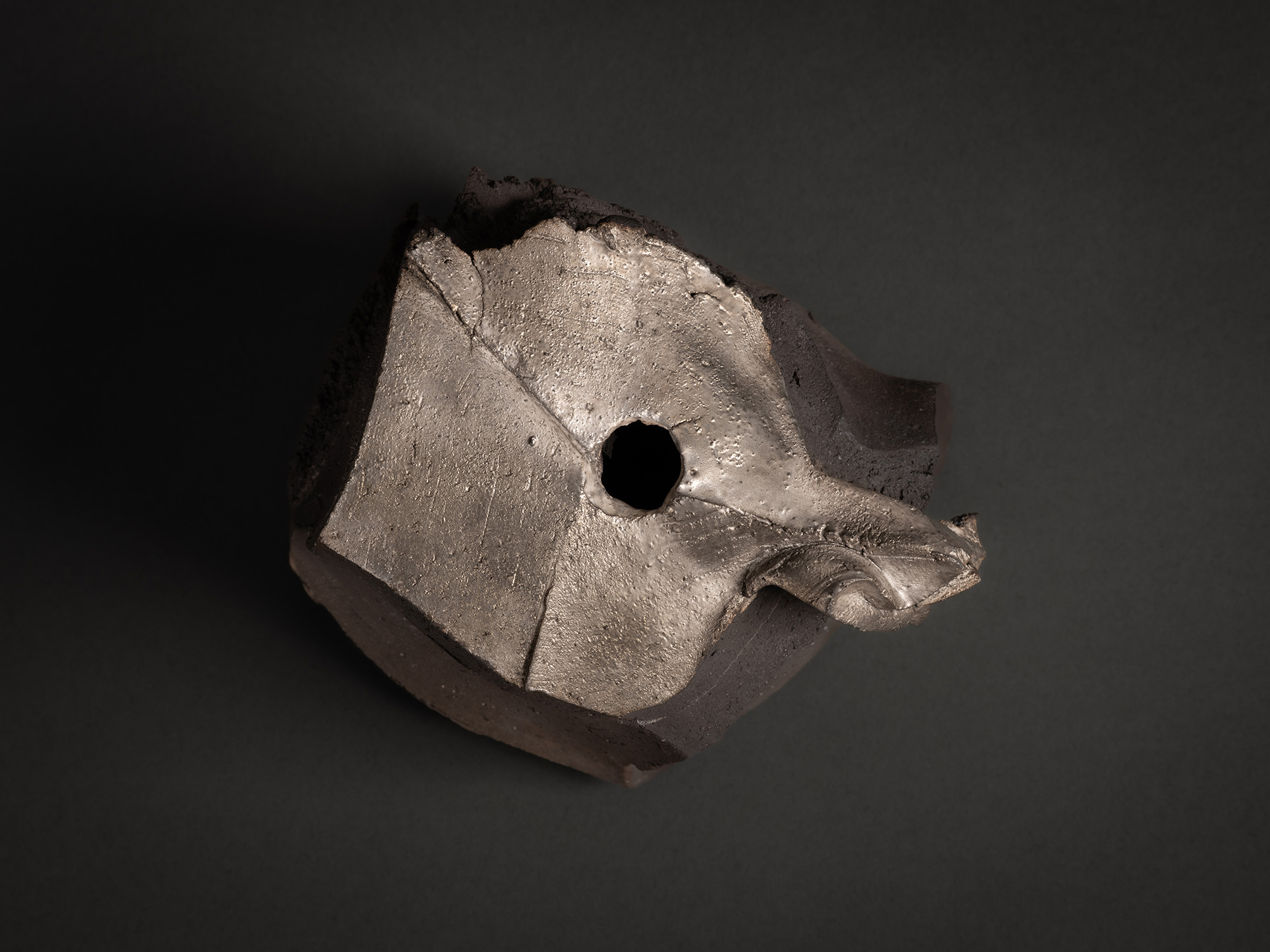 Aerial view of Tanka Silver Sculpture by Shozo Michikawa showing the irregular silver-glazed top...
