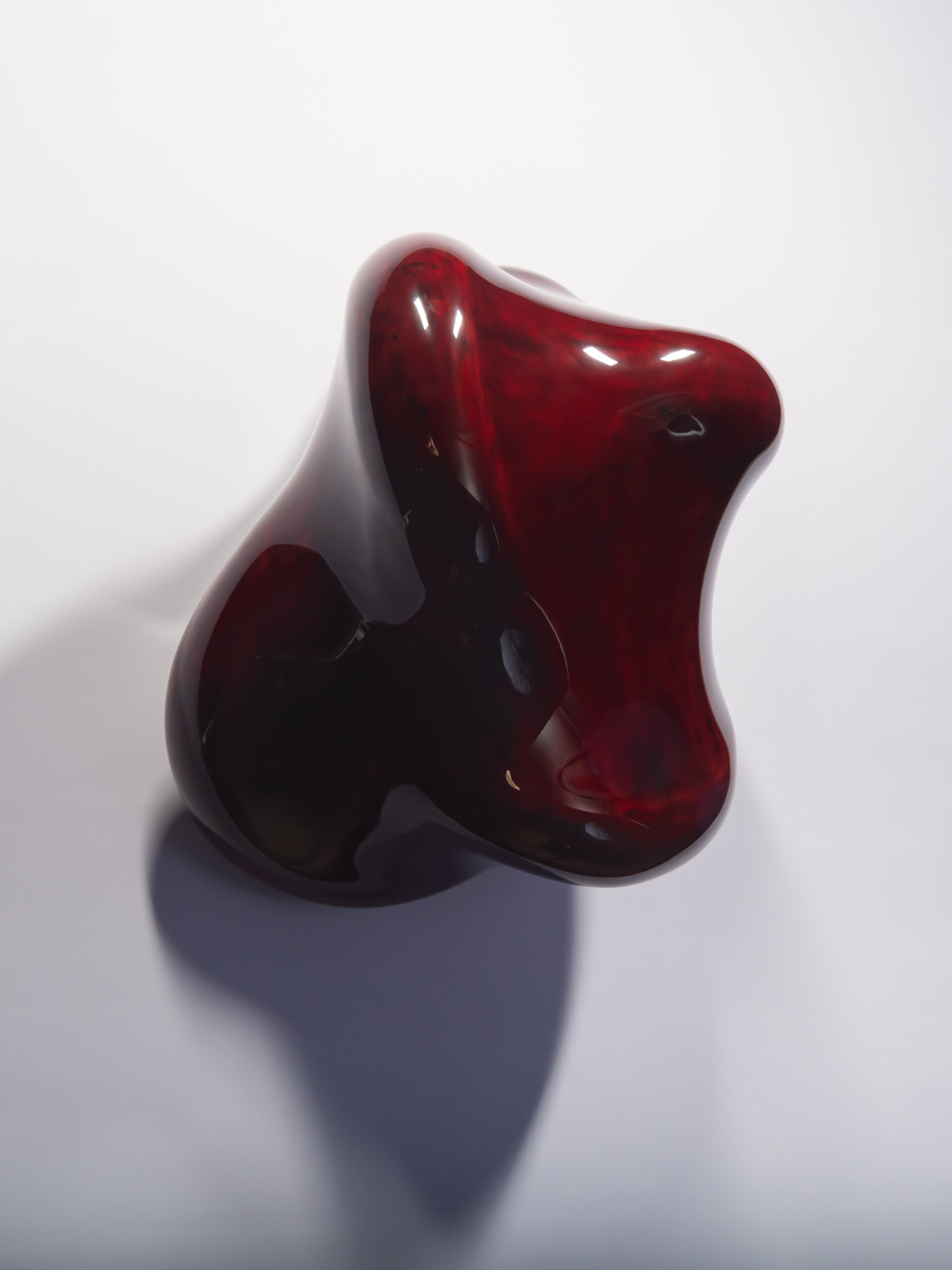 Front view of Taxis Groove #1 highlighting its flowing profile and undulating edges. Glossy red...