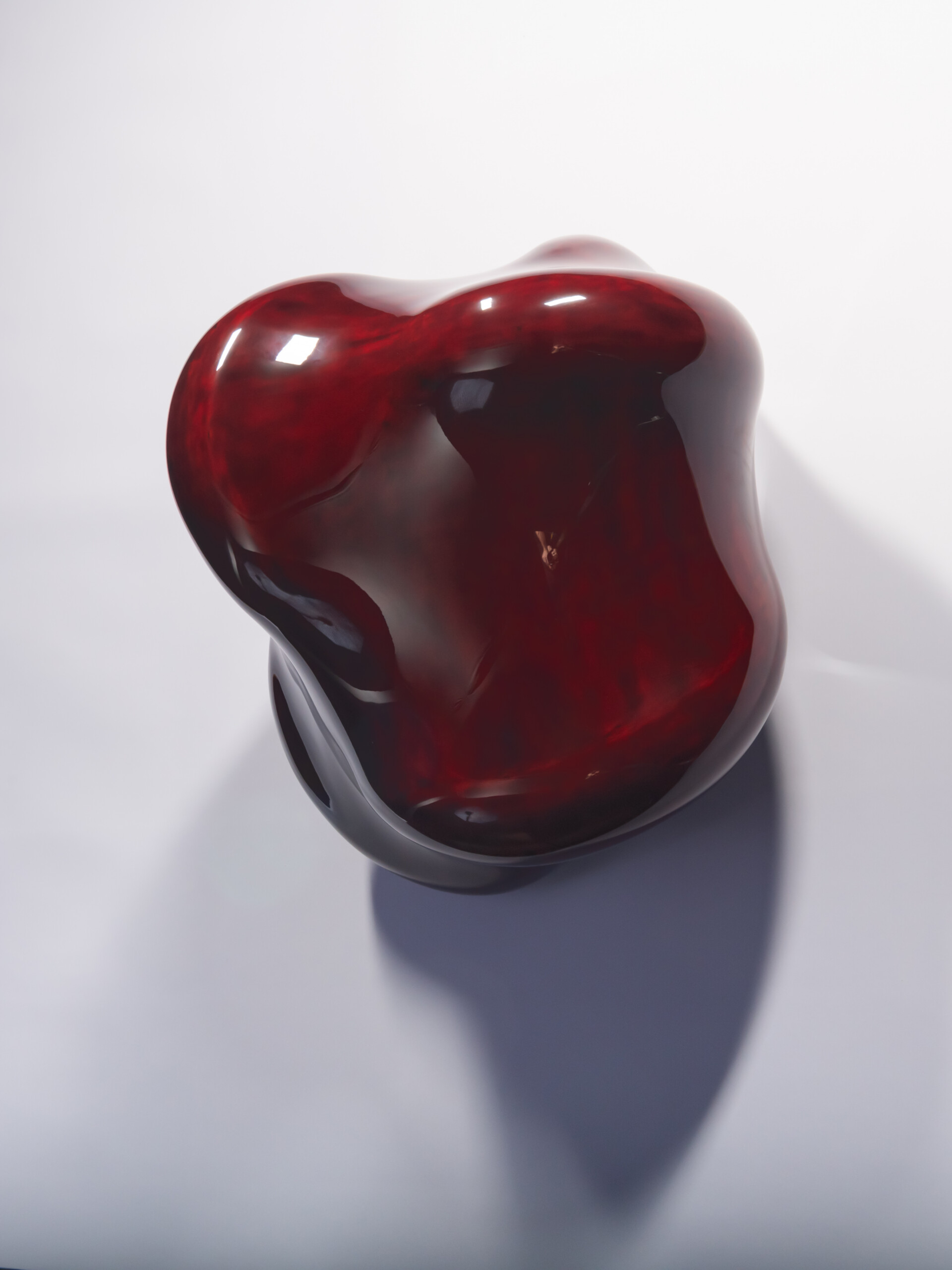 Taxis Groove #1 mounted on a white wall. The lacquer sculpture features a softly asymmetrical form...