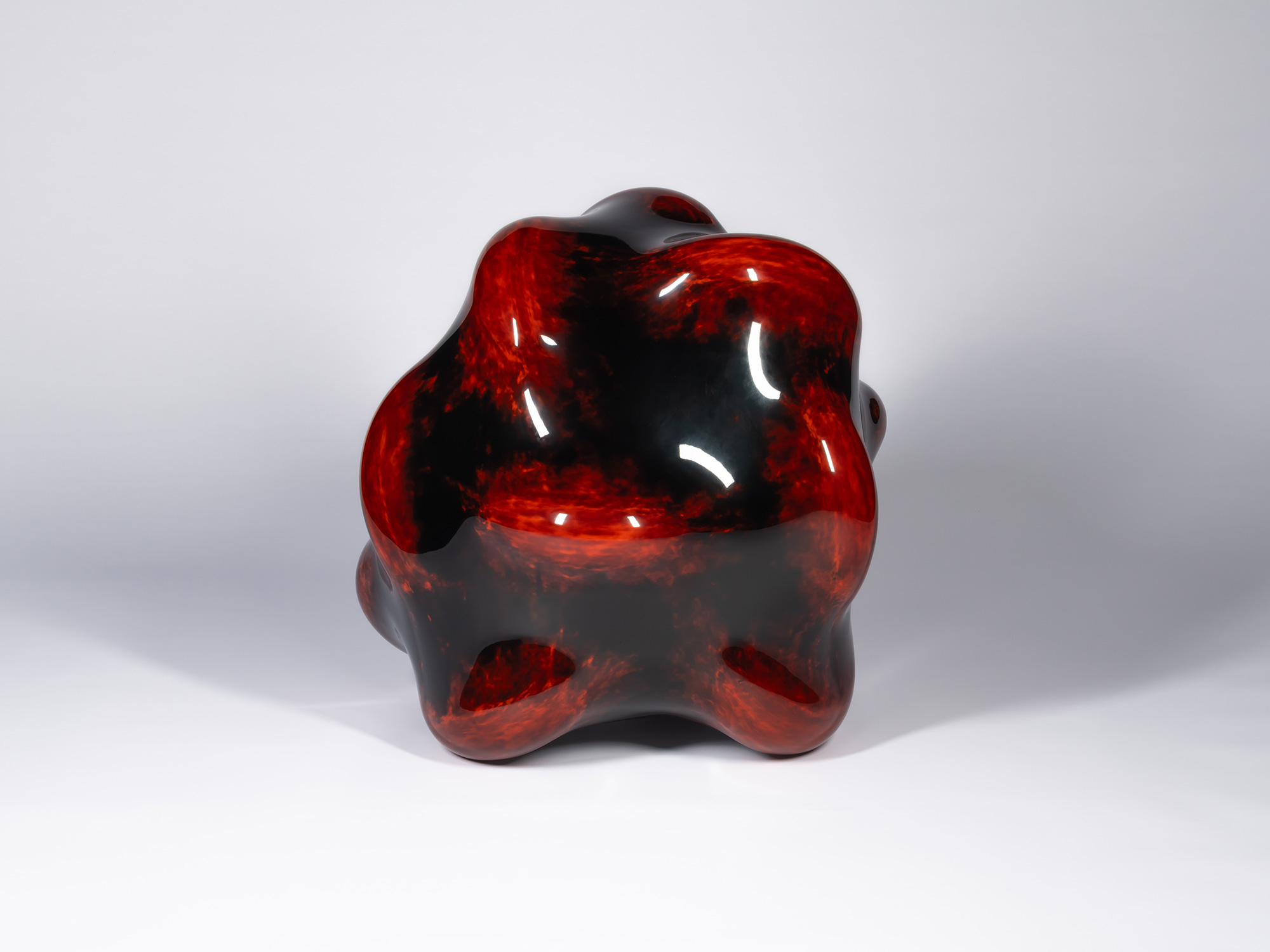 View of Taxis Groove – Bump. The sculpture presents a broad, rounded silhouette with softly undulating...