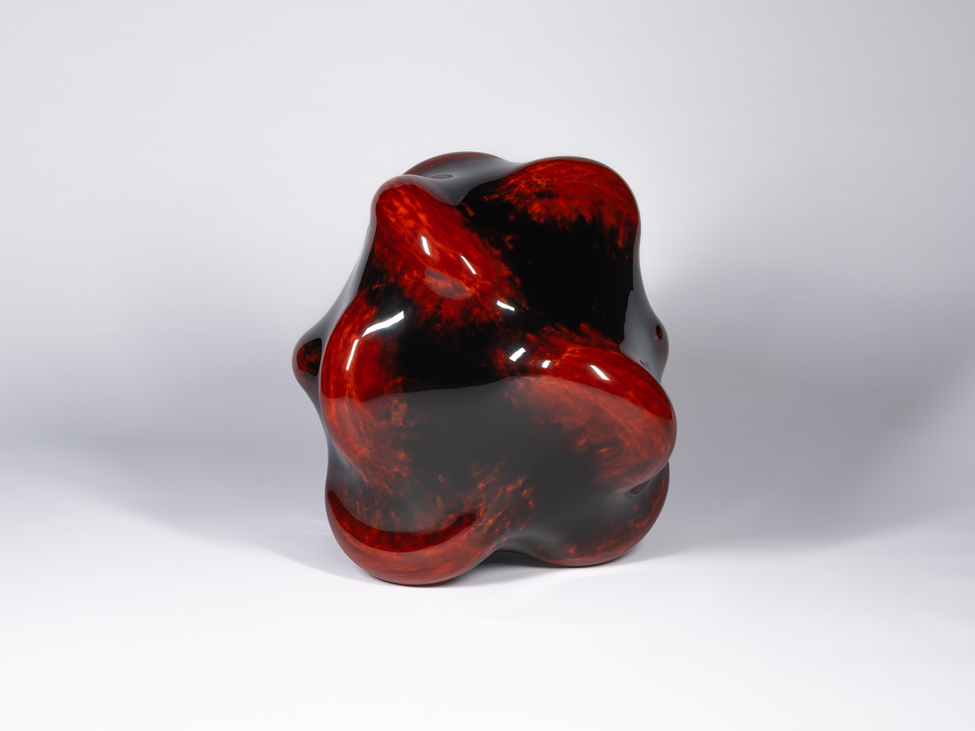 View of Taxis Groove – Bump by Ishizuka. The sculpture rises from a cluster of rounded feet into...