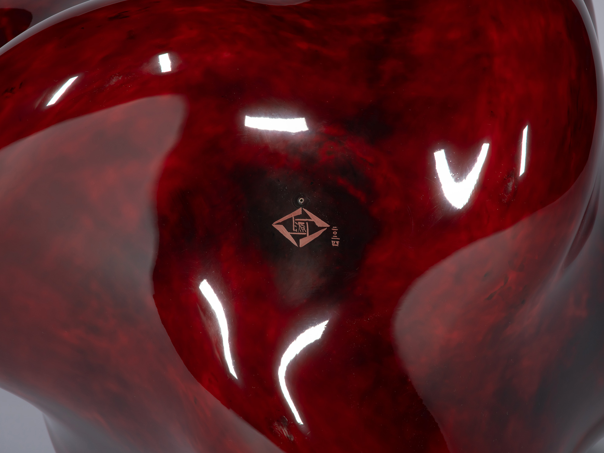 Close-up of the underside of Taxis Groove – Circulation showing the artist’s signature mark engraved...