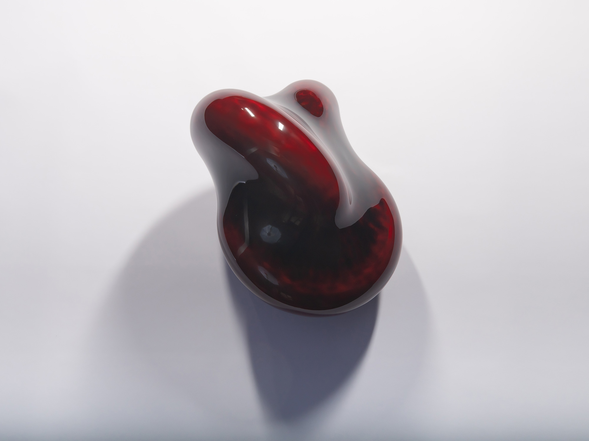 Alternate angled view of Taxis Groove (on wall) #4. The sculpture's rounded form wraps around a...