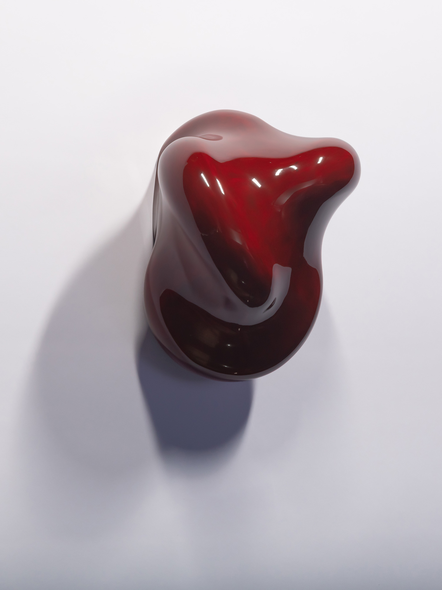 Taxis Groove (on wall) #5 by Ishizuka hangs on a white wall. The lacquer sculpture features a smooth,...