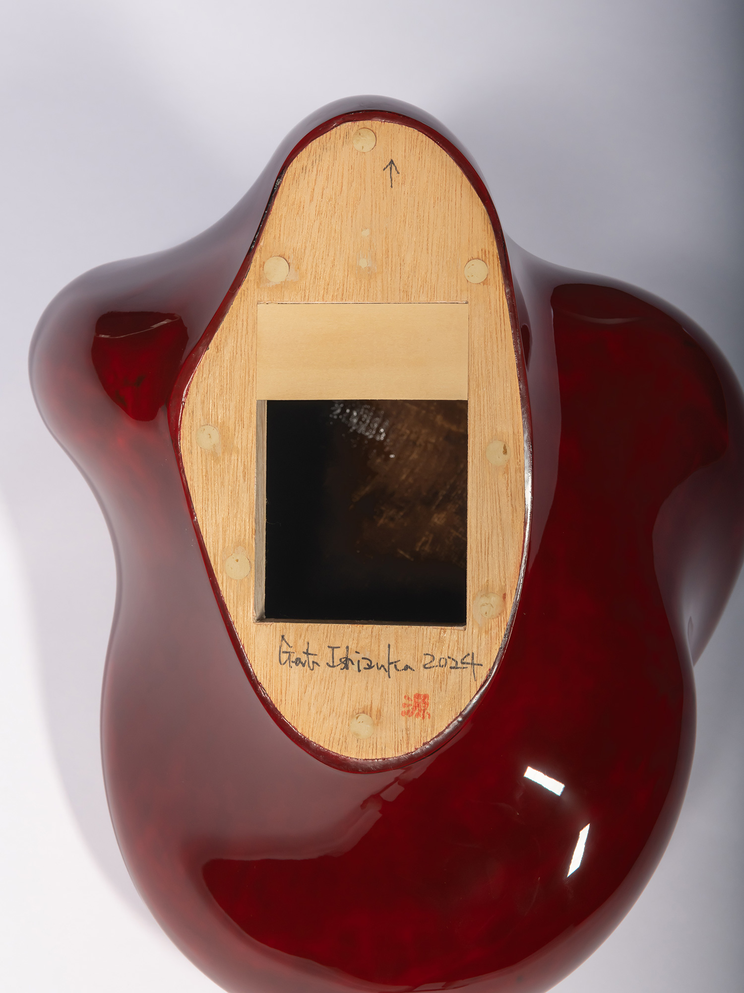 Back of Taxis Groove (on wall) #5. A light wood mounting panel is inset into the back of the lacquer...