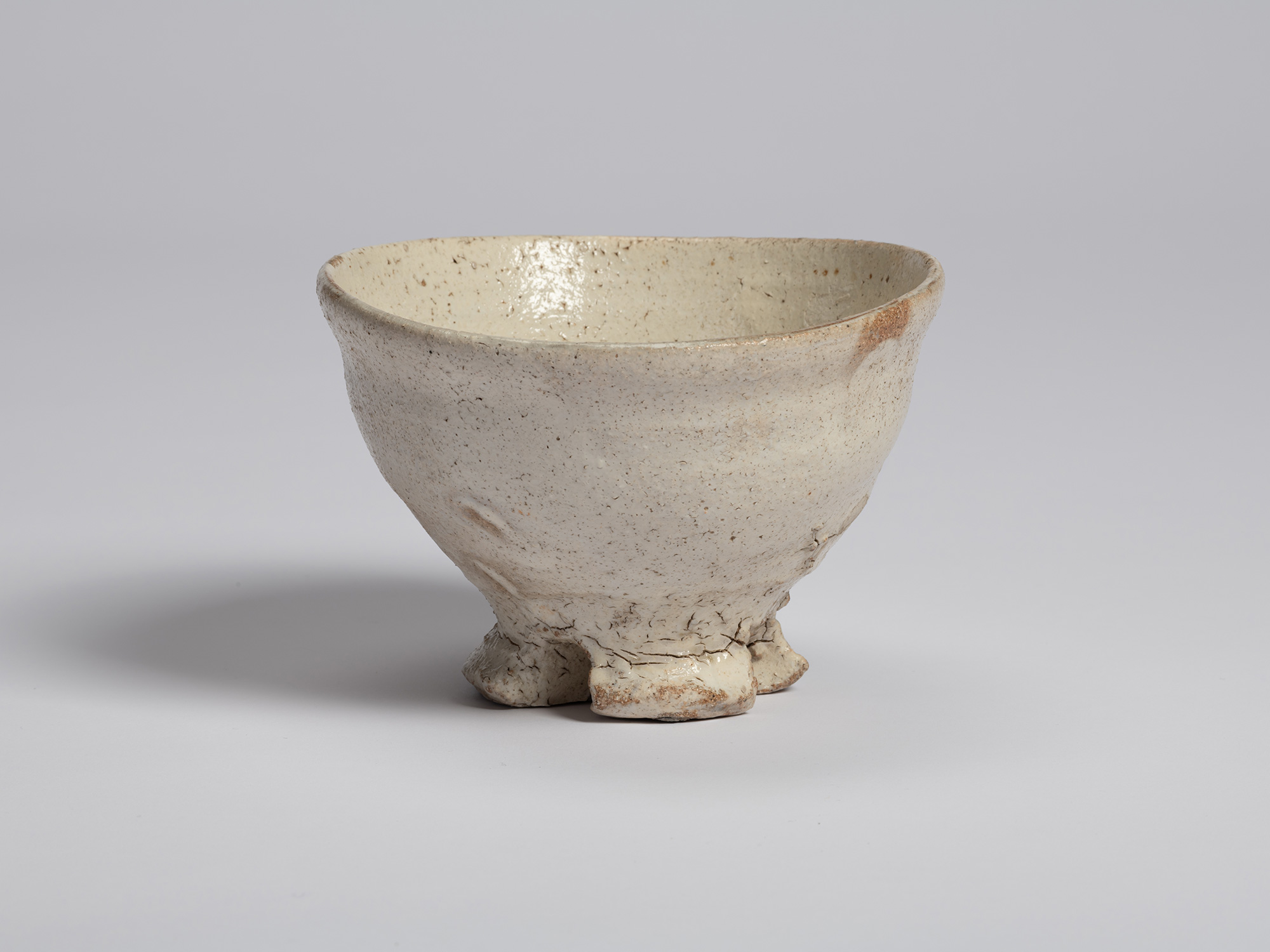 Three-quarter view of Tea Bowl (Tripodal Foot) by Shiro Tsujimura. The bowl’s gently expanding...