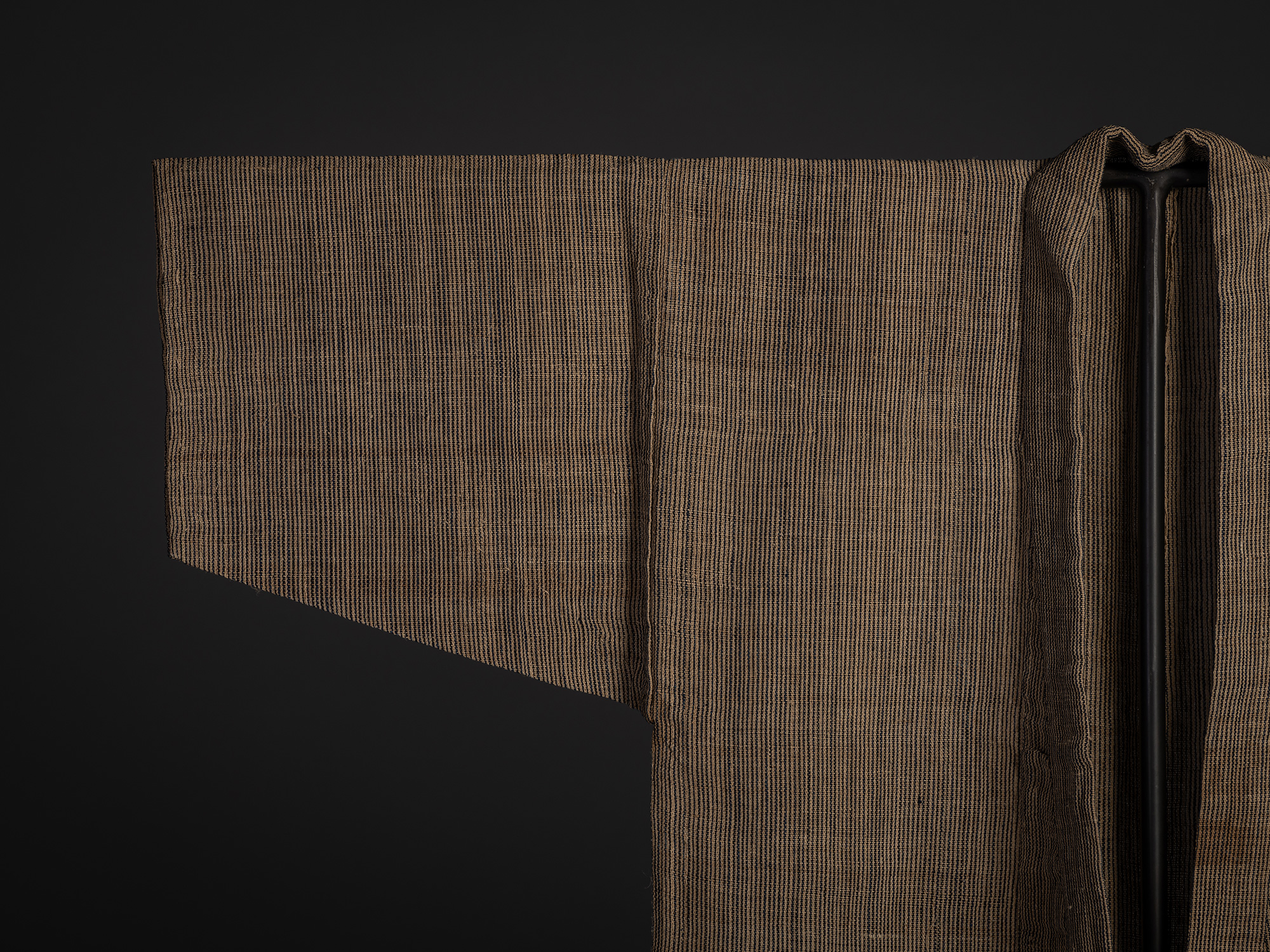 Close-up of the upper front and sleeve of the Tsushima katabira kimono, showing the open front,...