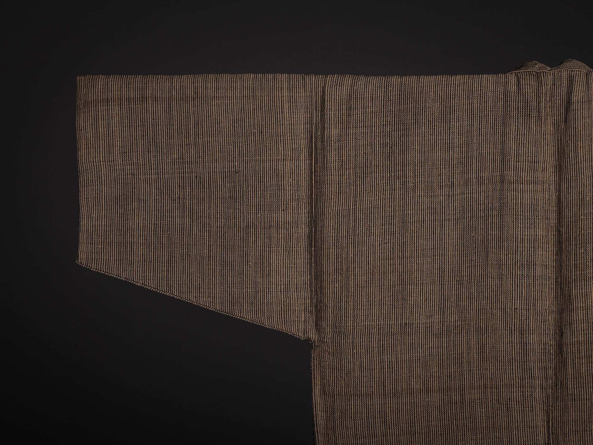 Close-up of the upper back and sleeve of the Tsushima katabira kimono. The image highlights the...