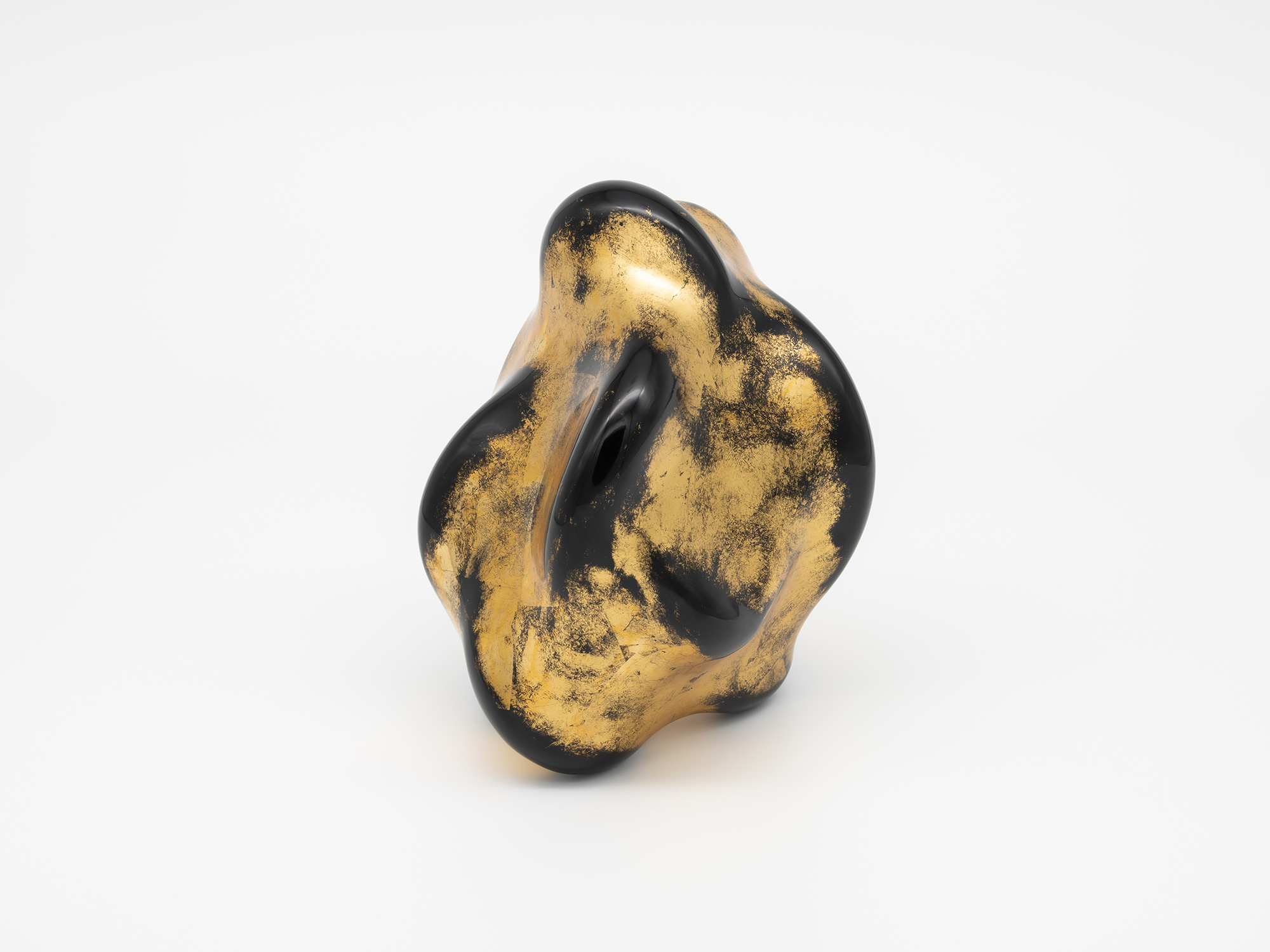 View of Untitled (Faded Gold) by Genta Ishizuka. The sculptural lacquer form features an irregular,...