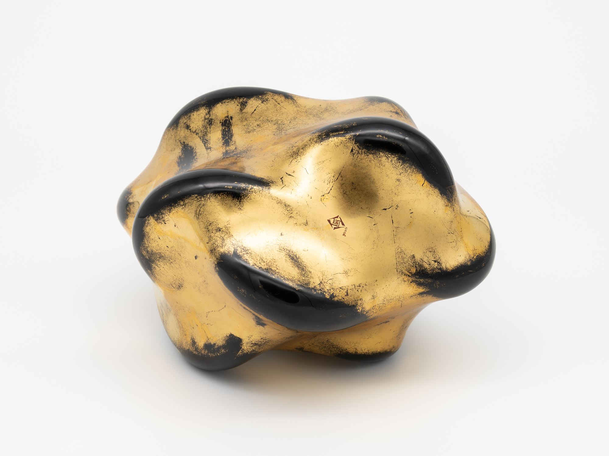 Bottom view of Untitled (Faded Gold) revealing the underside of the sculpture. The base features...