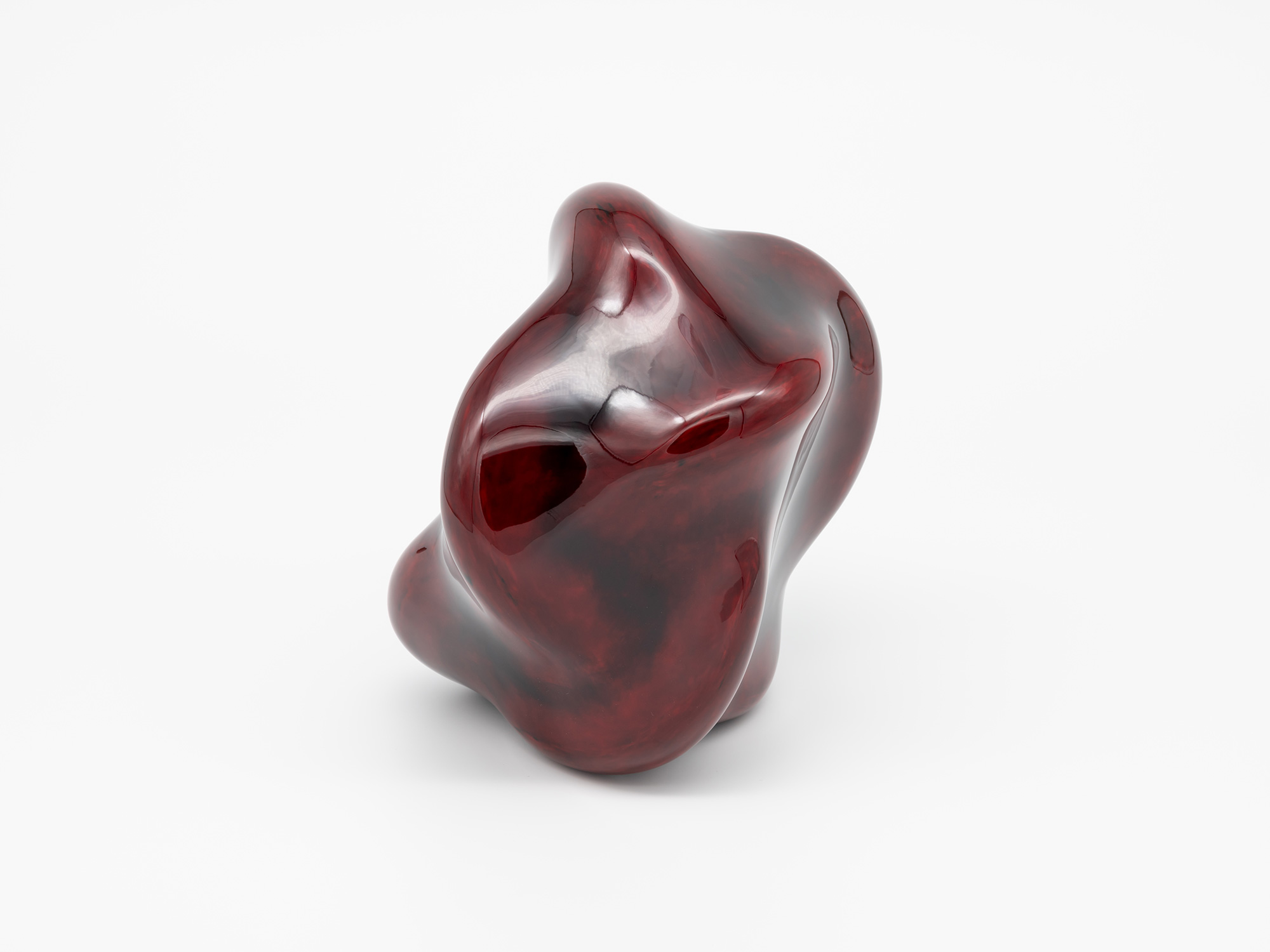 Side view of Untitled (Star) highlighting the sculpture’s vertical presence and flowing contours....