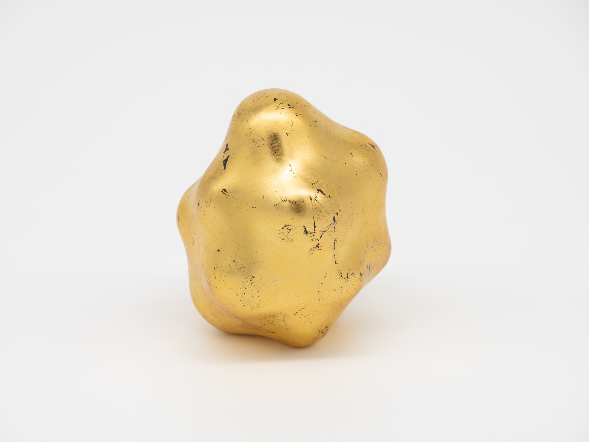 Side view of Untitled highlighting its asymmetrical profile. Rounded peaks and recessed areas flow...