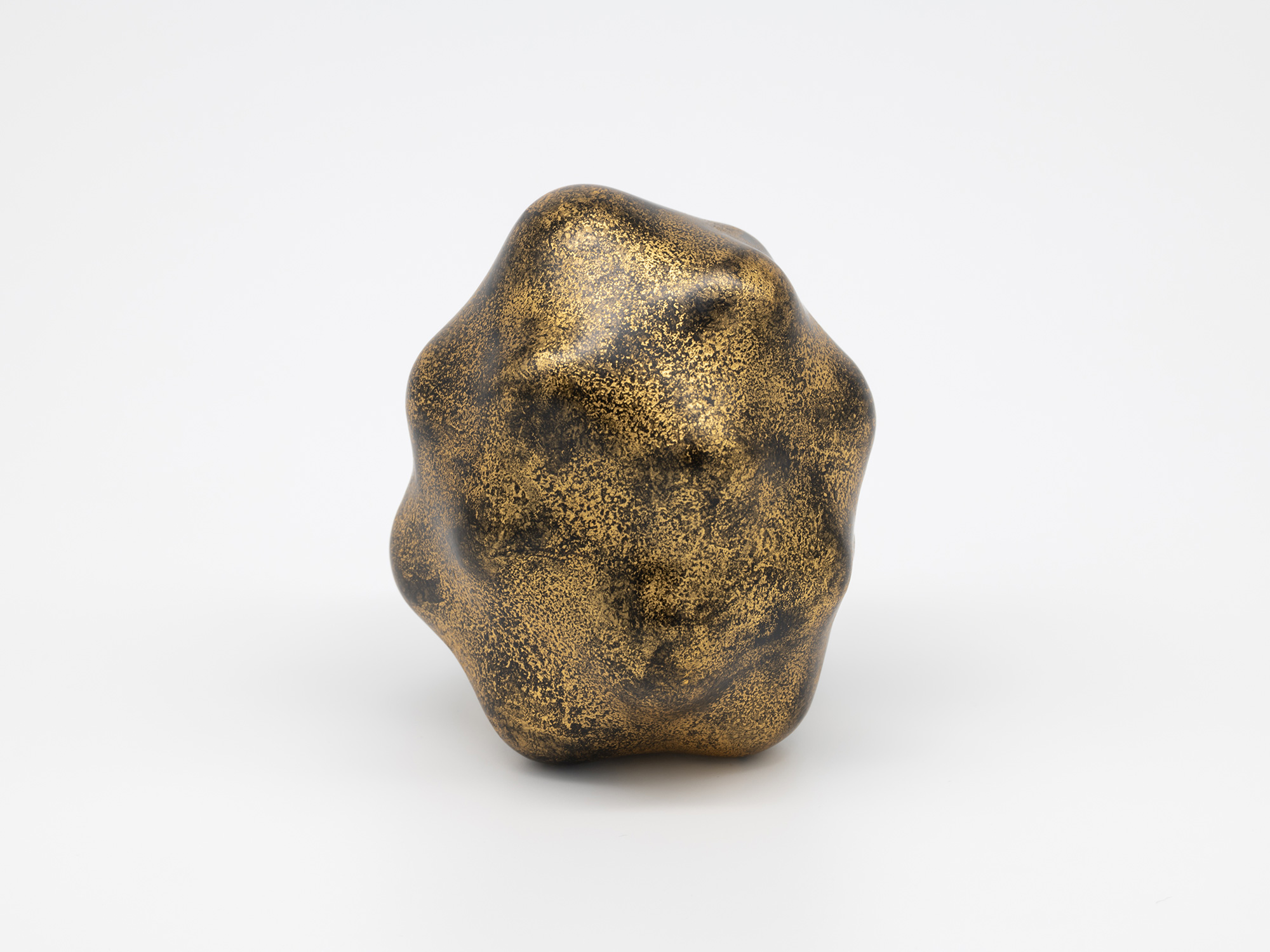 A compact, organic sculpture by Genta Ishizuka featuring a bulbous, asymmetrical form with rounded...