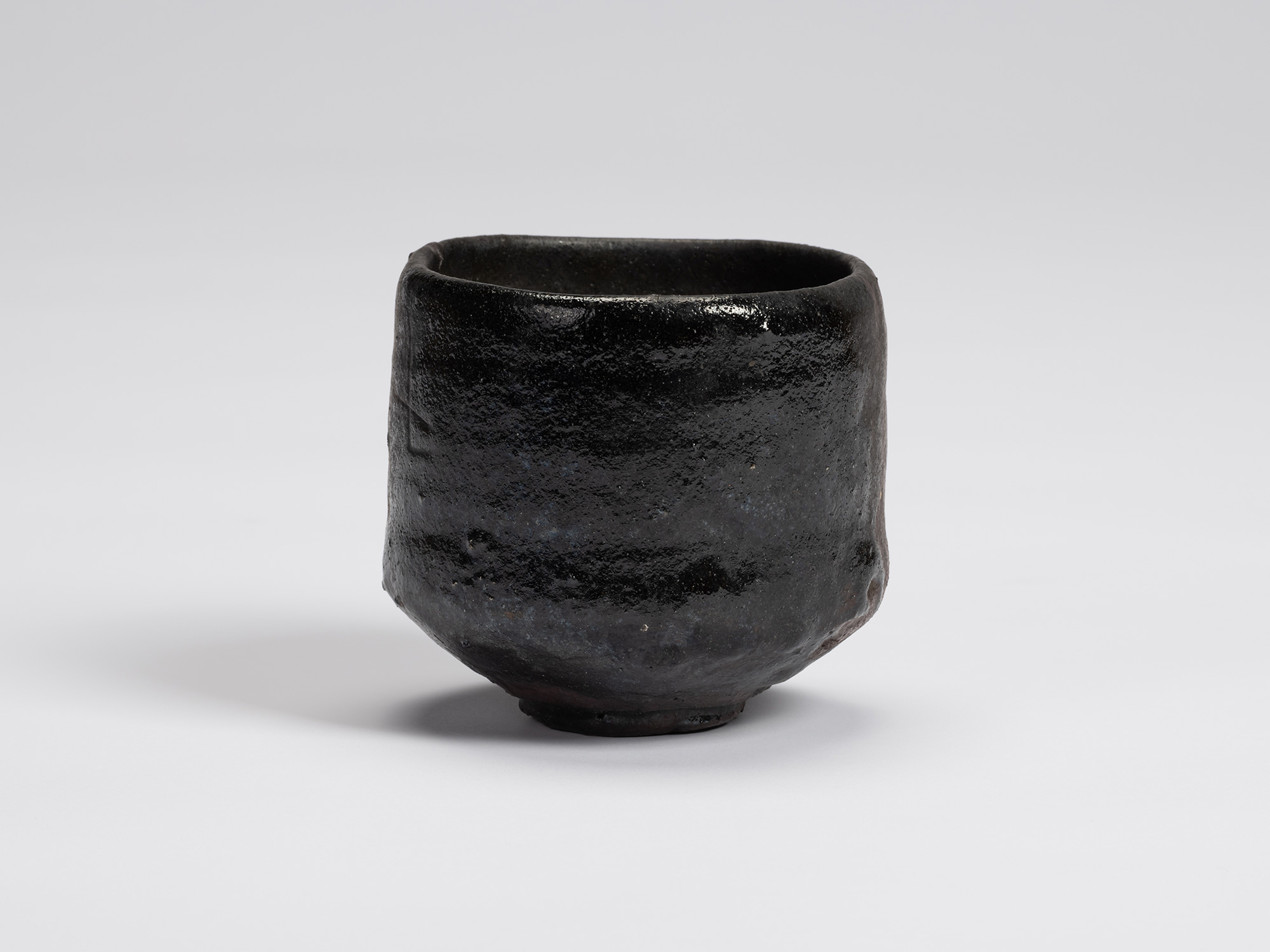 Front view of Chawan No. 6 by Shiro Tsujimura, a hand-formed black tea bowl with gently rounded...