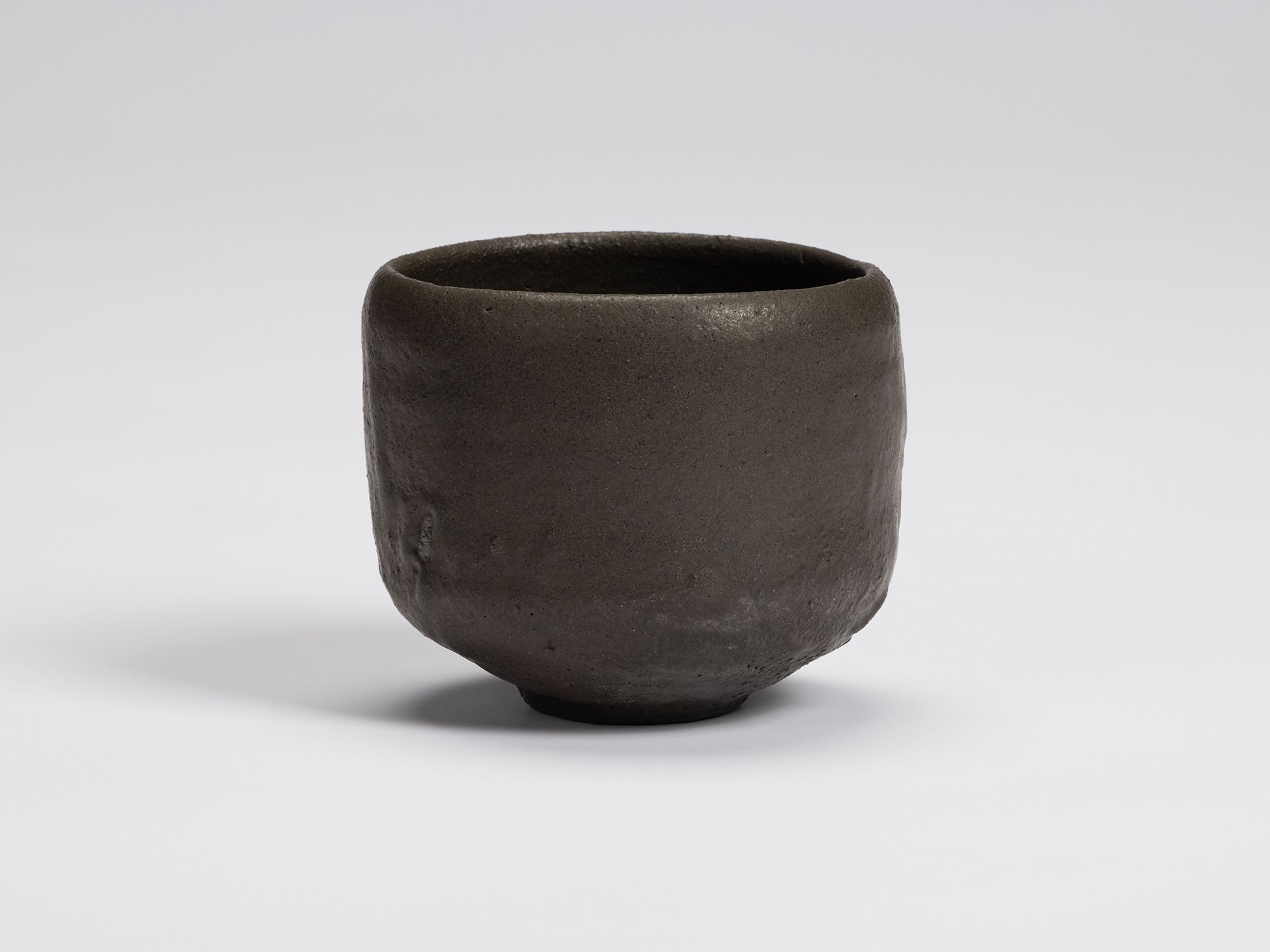 Front view of Chawan No. 9 by Shiro Tsujimura. The hand-formed tea bowl has a gently rounded cylindrical...